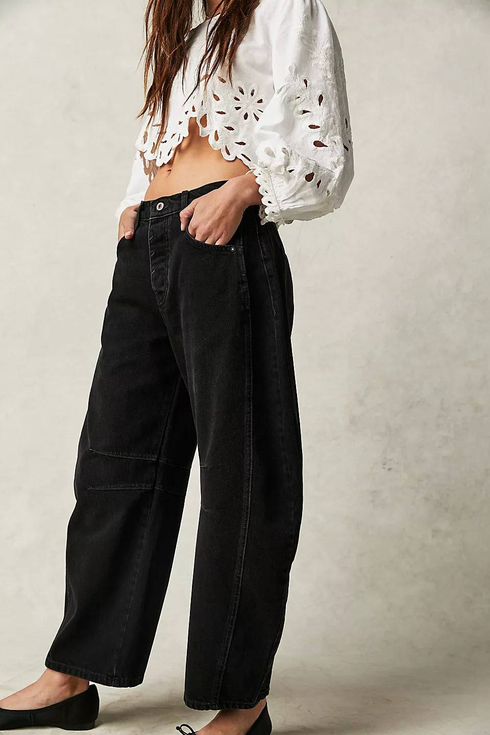High stretch mid-rise black wide leg denim jeans for women, casual baggy fit with loose legs and mid waist design.