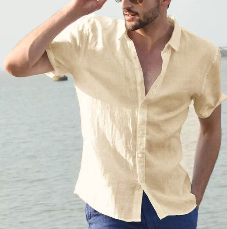 Man wearing beige summer short-sleeved casual button-up shirt by the water