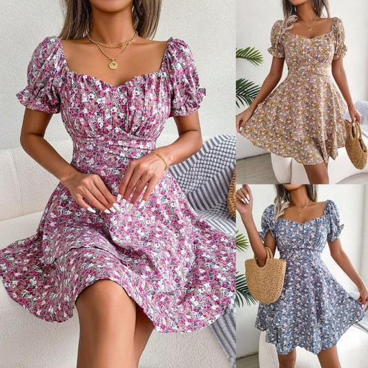Women mini dress with floral print, short sleeves, square neckline, and loose swing hem in pink, yellow, and blue colors.
