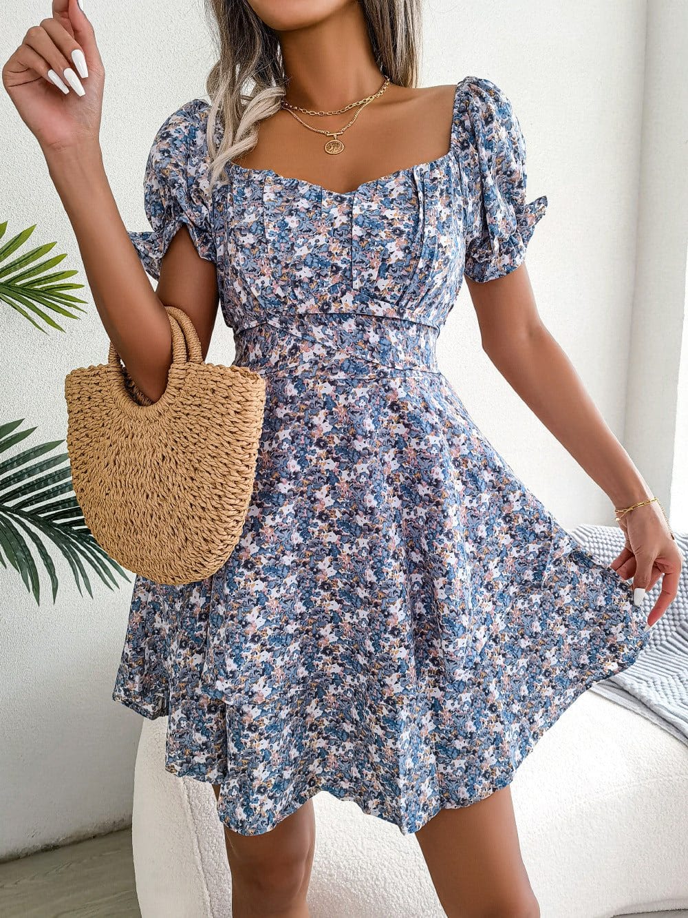 Women mini dress with floral print, puff short sleeves, high waist, and loose A-line skirt, perfect for summer.