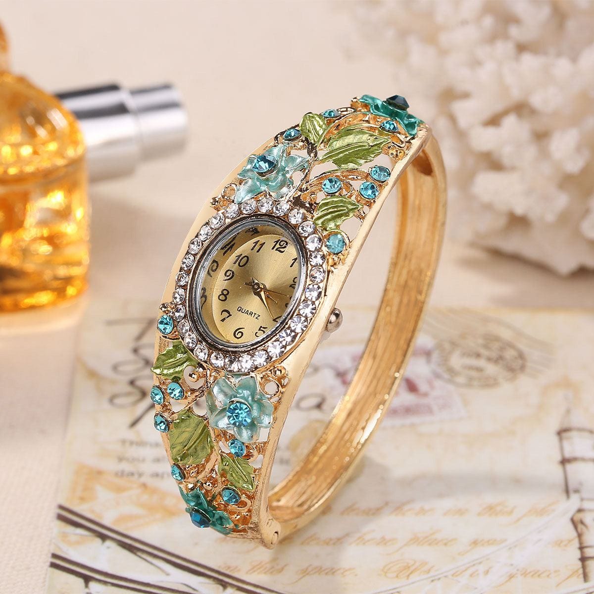 Elegant blue vintage court style women's wristwatch with floral and crystal accents