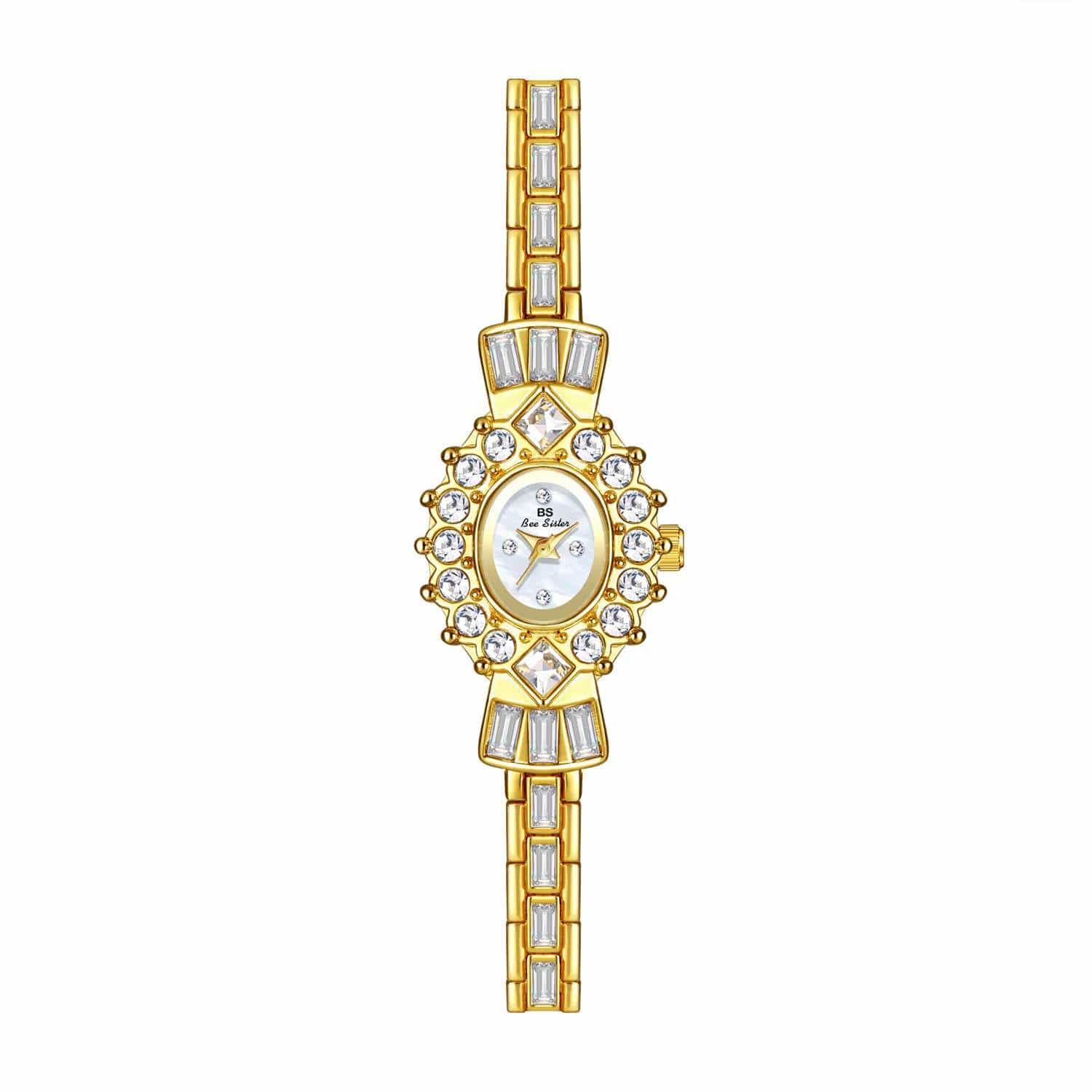 Women's gold bracelet watch with diamond accents and barrel-shaped dial, spiral crown, and mineral glass mirror