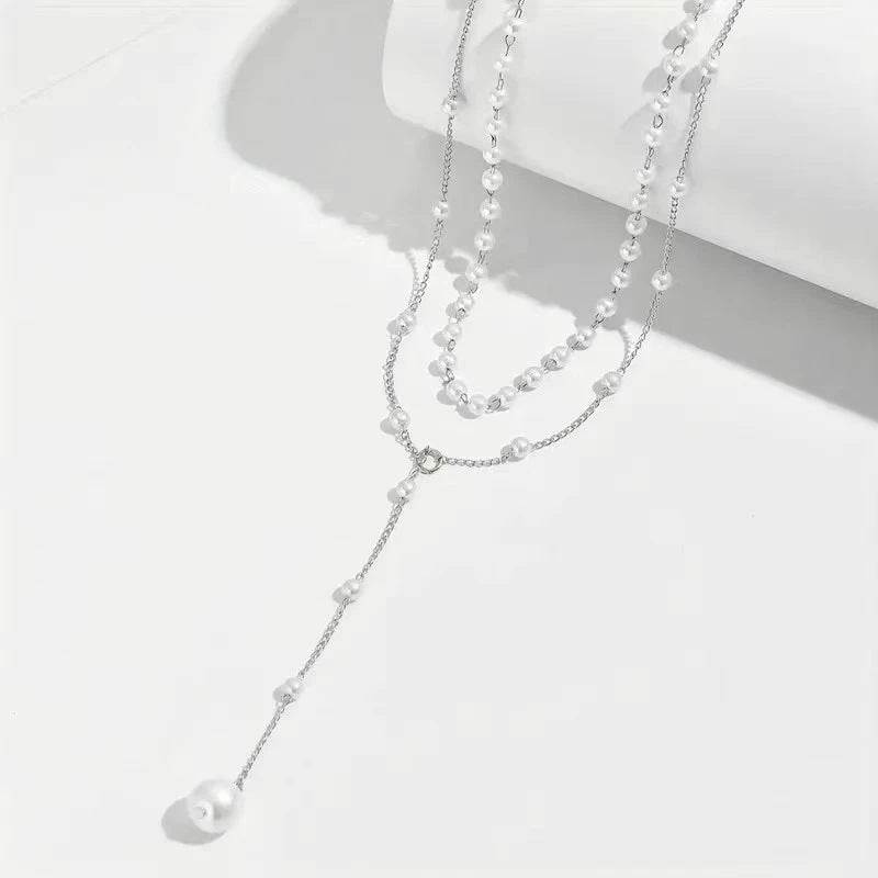 Elegant pearl double layer necklace with geometric alloy pendant and cross chain design