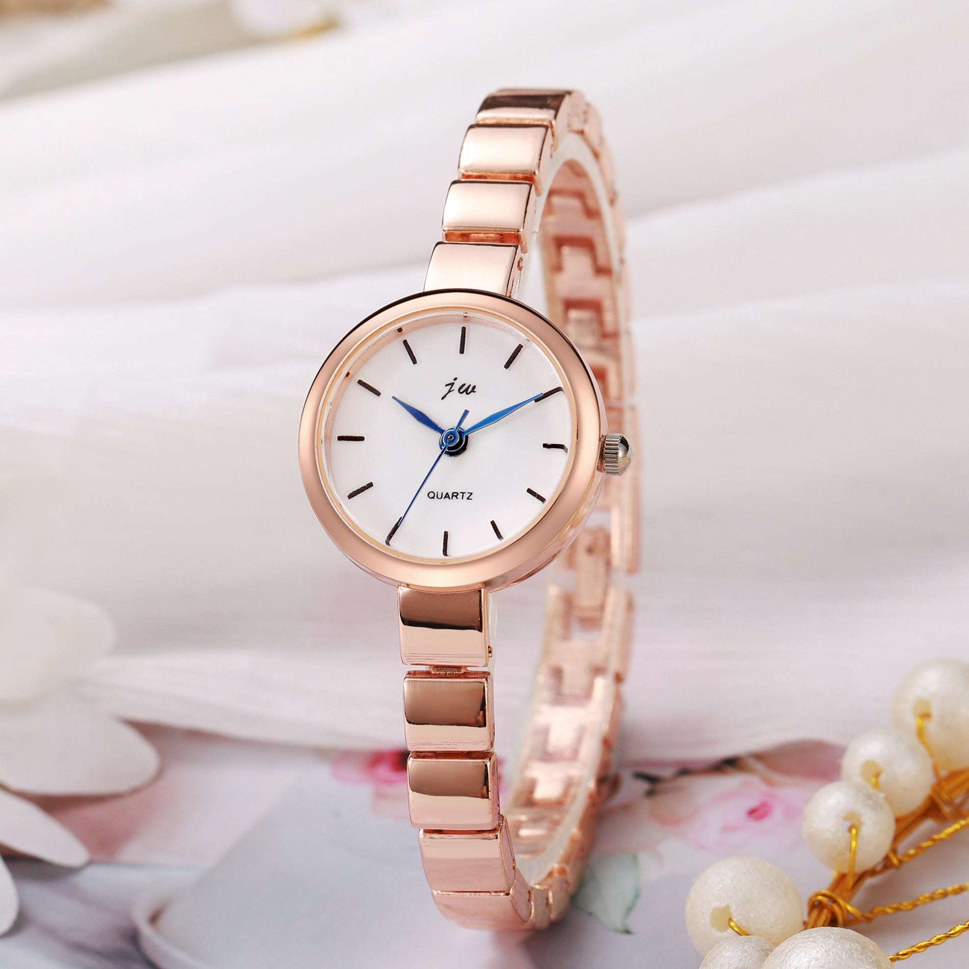 Women's niche steel watch with simple round white dial and rose gold alloy strap