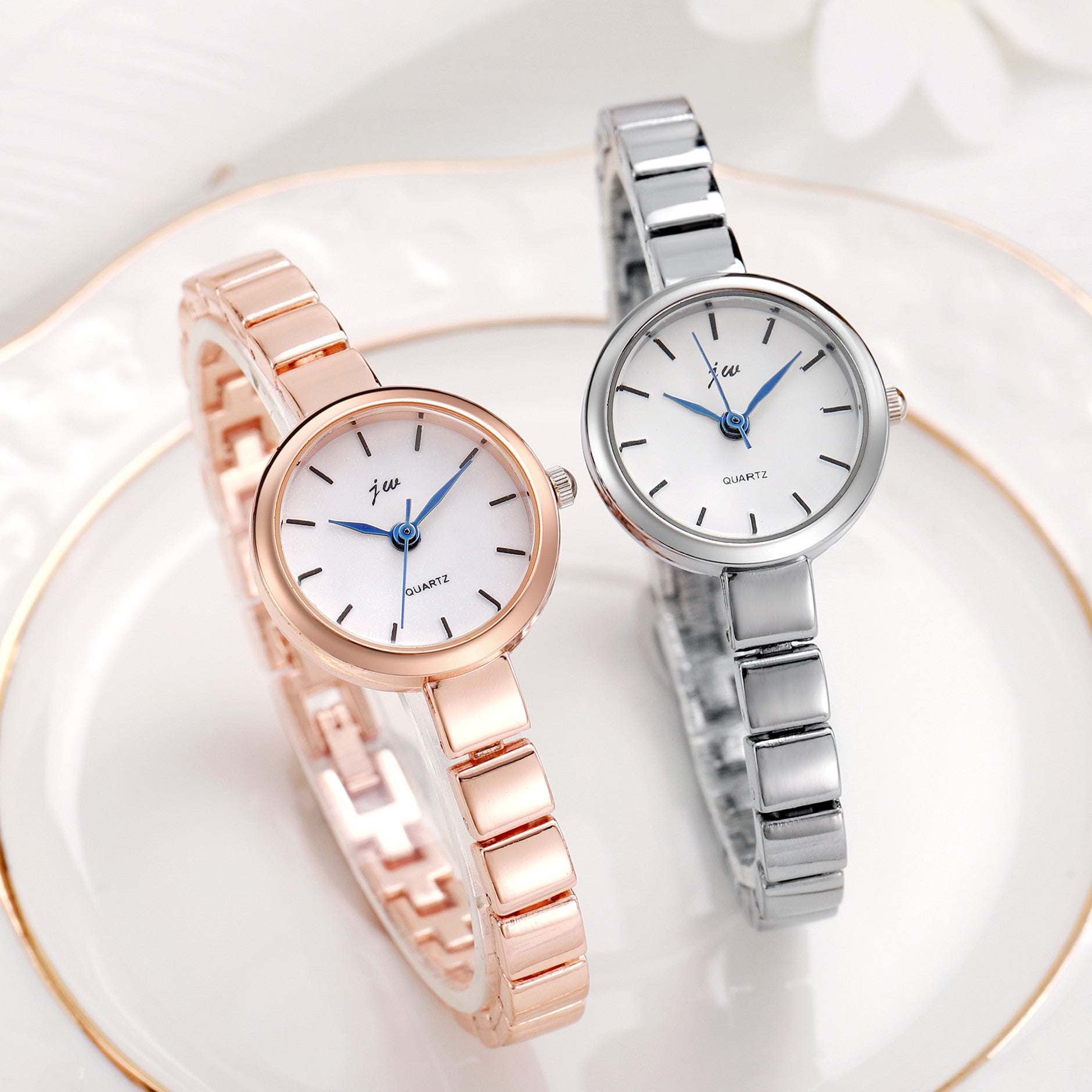 Two elegant Niche Steel Watch Women's simple design wristwatches with round white dials, one in gold-tone and one in silver-tone steel straps.