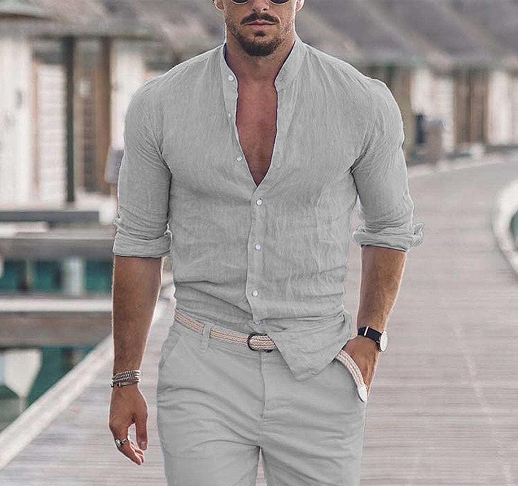 Men's casual long sleeve button shirt in solid light gray with rolled-up sleeves, styled for spring and autumn wear.