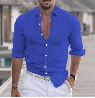Men's long sleeve solid color casual button-up shirt in blue with rolled cuffs
