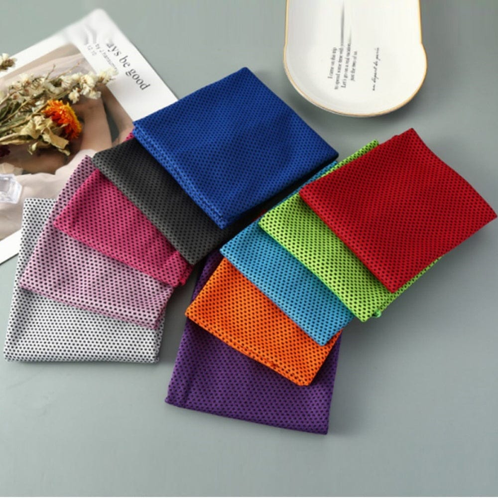 Colorful microfiber sports towels arranged on a gray surface for cooling and quick drying during gym, swimming, yoga, running, and cycling.