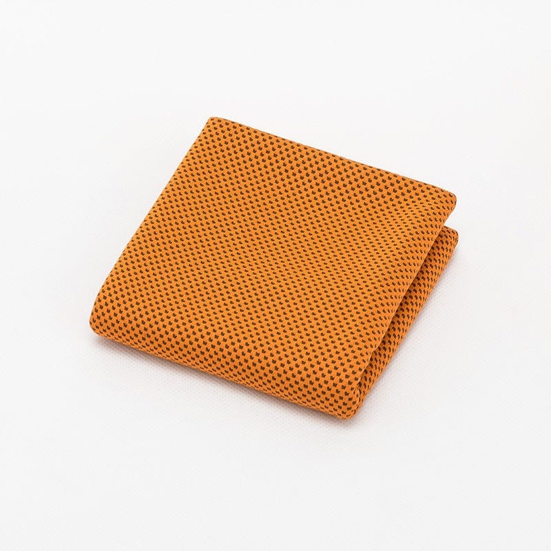Orange foldable sports towel made of breathable cooling microfiber fabric for gym and outdoor activities