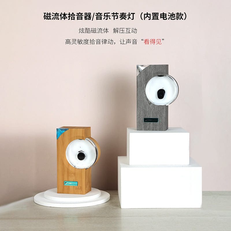 Dancing ferrofluid music rhythm magnetic fluid speakers in modern wooden and gray rectangular designs on white pedestals