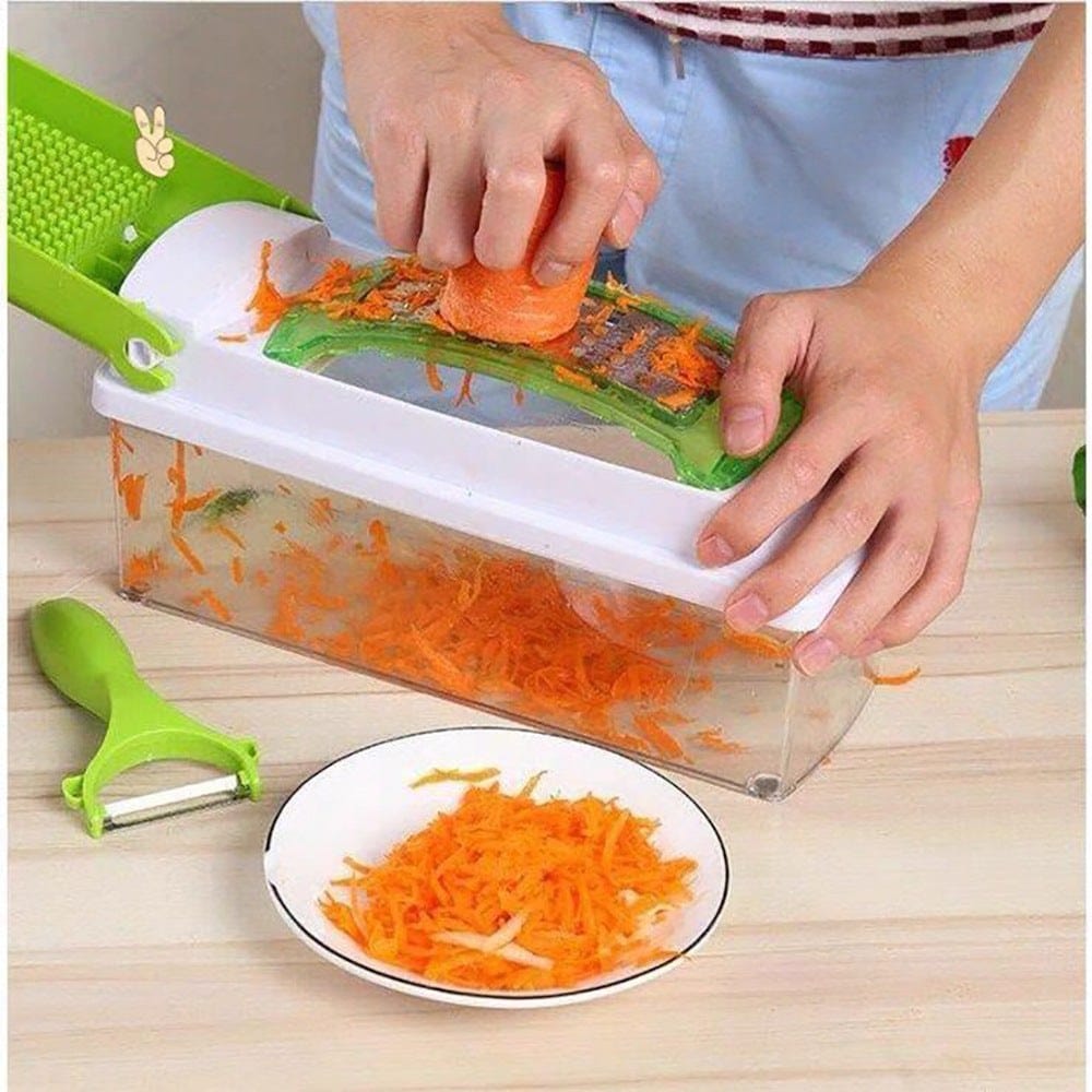 Handheld food grate chopper slicing carrots into a container with a green peeler and a plate of shredded carrots nearby.