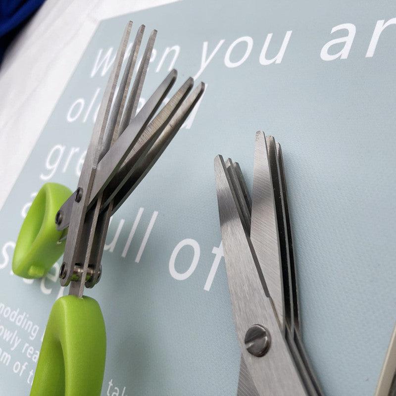 Multifunctional multi-layer green onion scissors with stainless steel blades and green handles for efficient herb and spice cutting.