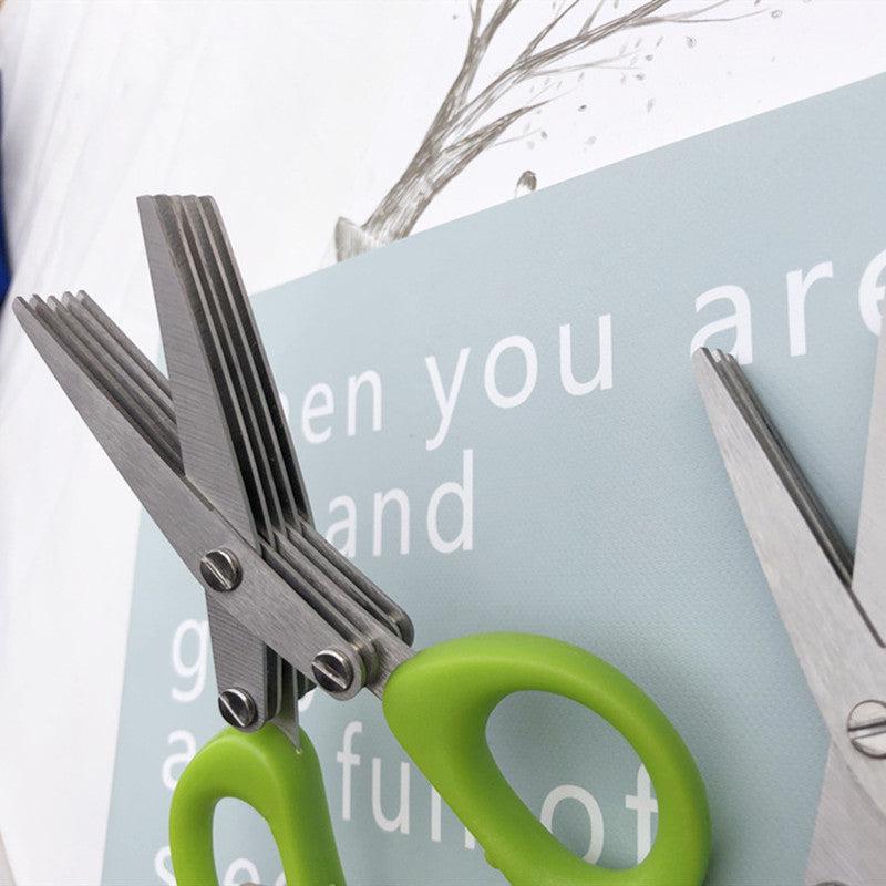 Multifunctional multi-layer green onion scissors with stainless steel blades and green handles for cutting herbs and spices.