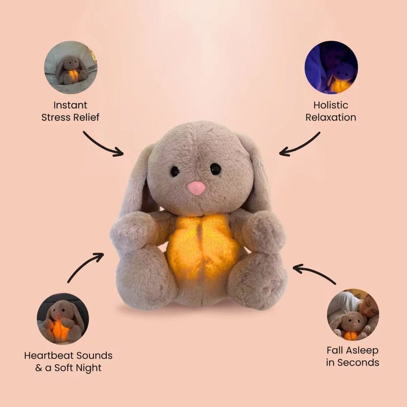 Soft grey breathing rabbit plush toy with glowing belly, soothing heartbeat sounds, and calming lights for infant anxiety relief and sensory comfort.