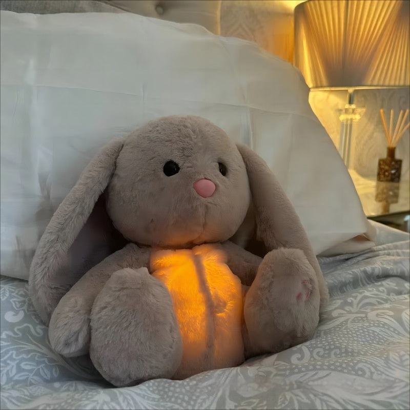 Soft plush breathing rabbit toy with glowing belly for baby comfort and anxiety relief