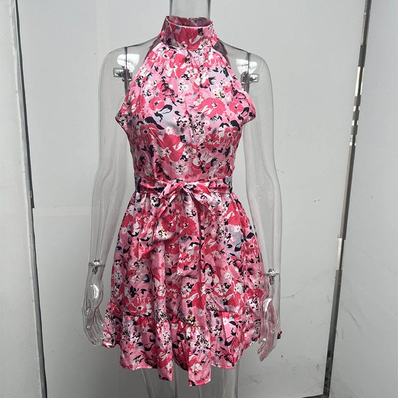 Pink floral print halterneck dress with ruffled hem and lace-up waist detail on mannequin