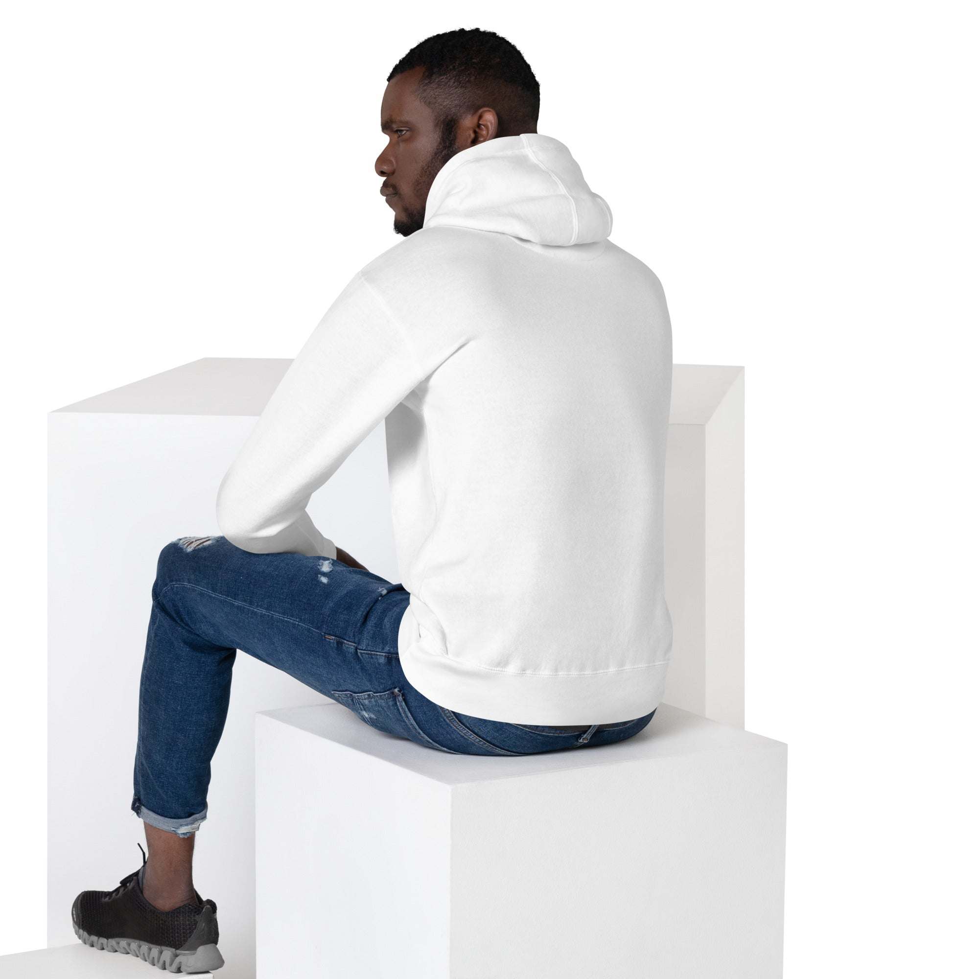 man wearing white Basketball Dunk Hoodie sitting on white block from back view