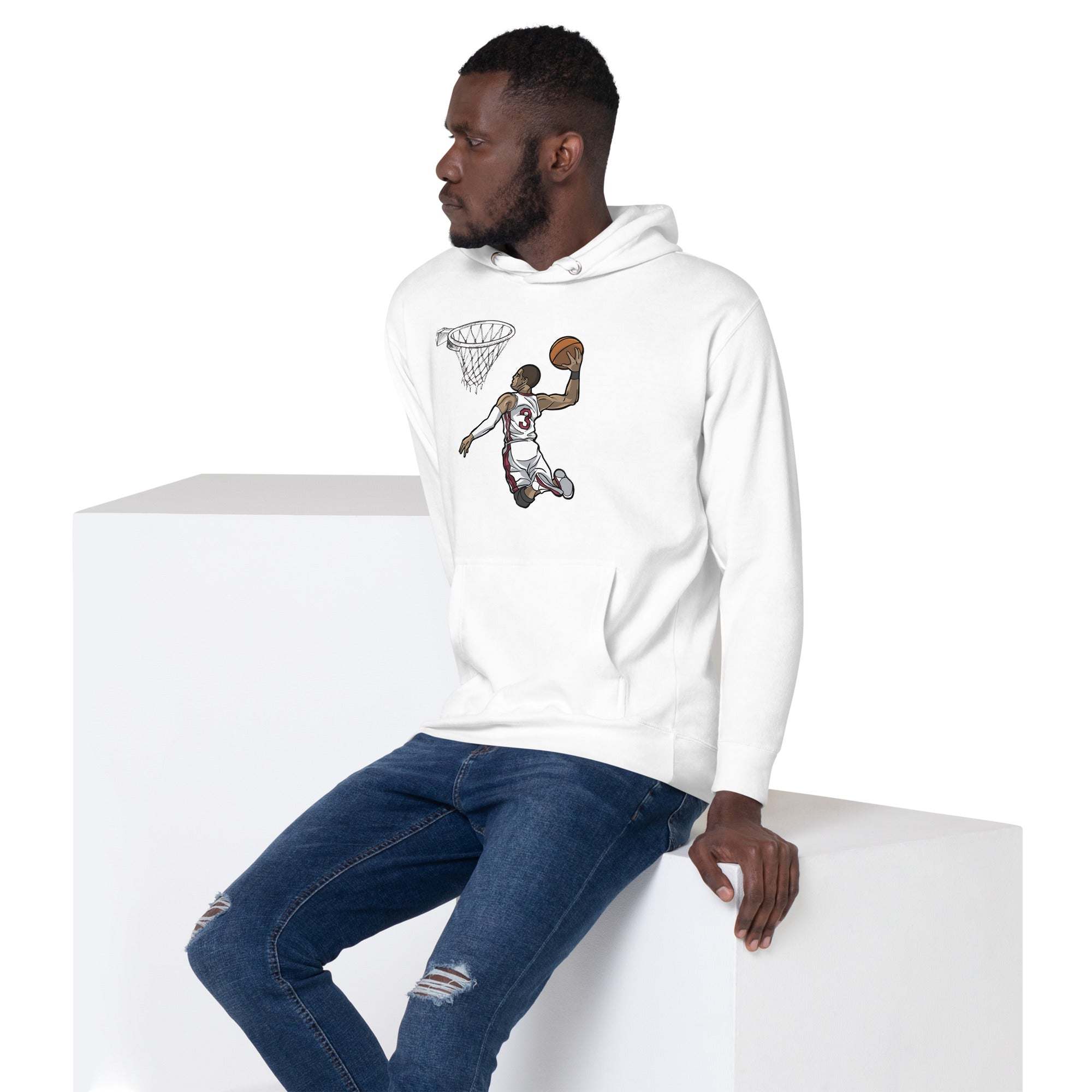 Unisex white basketball dunk hoodie with slam dunk graphic worn by a man sitting on a white block