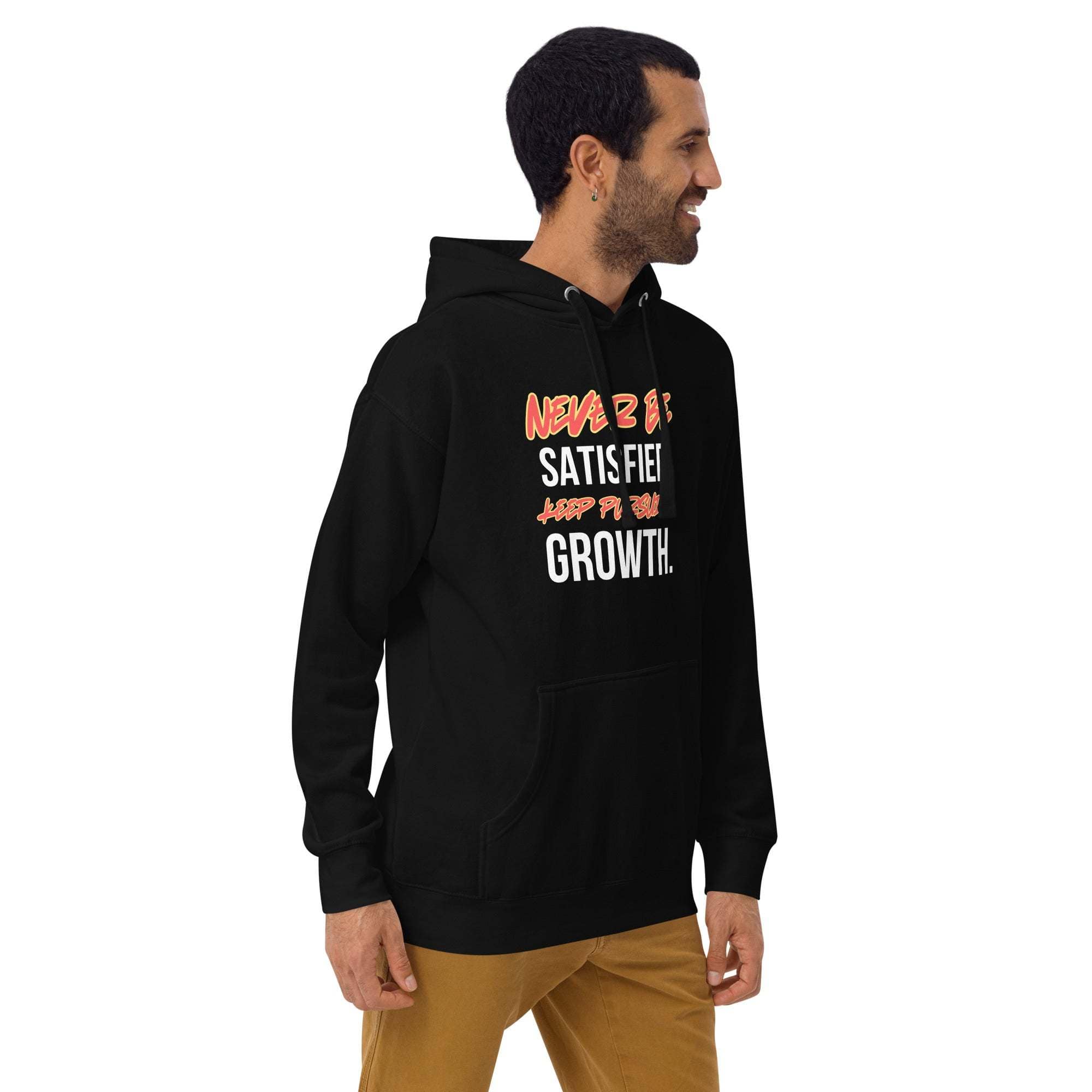 Man wearing black "Keep Seeking Growth Hoodie" with motivational text, paired with brown pants, casual style