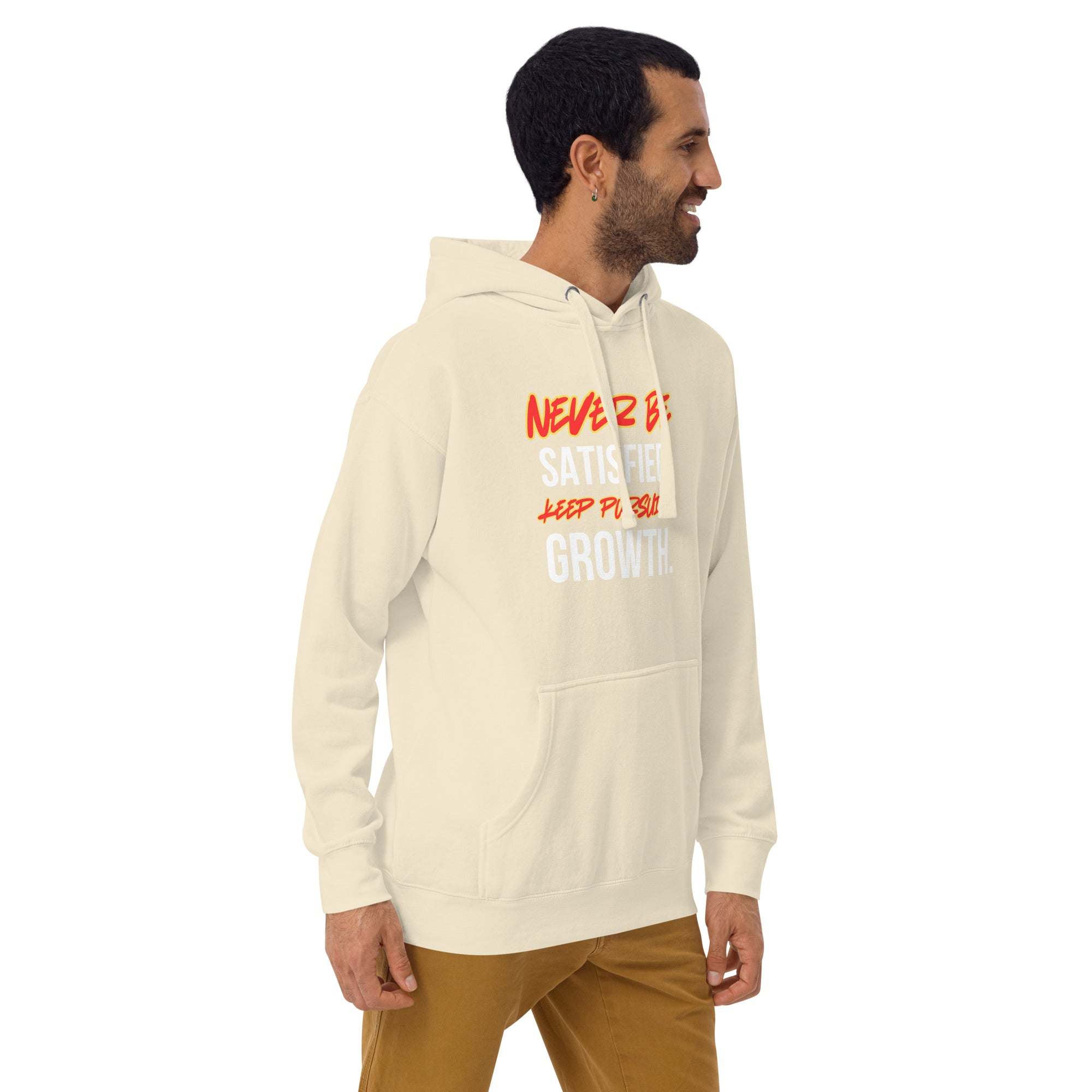 Man wearing beige Keep Seeking Growth hoodie with motivational text, styled casually