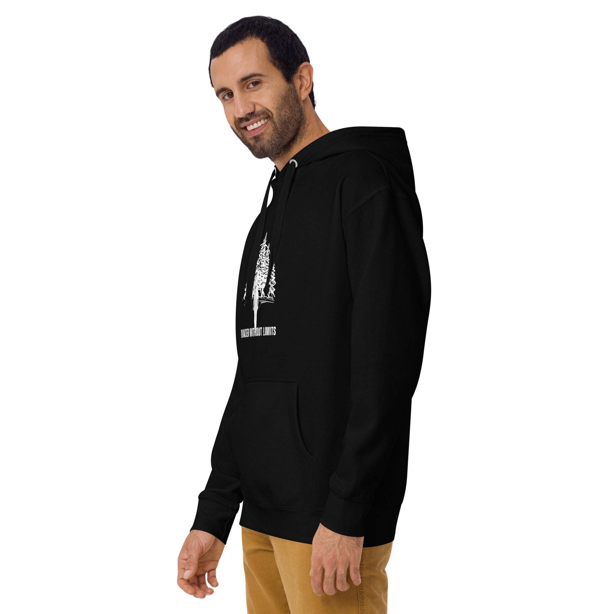 Man wearing black Wander Without Limits Hoodie with wilderness graphic and front pocket, styled casually for outdoor adventure