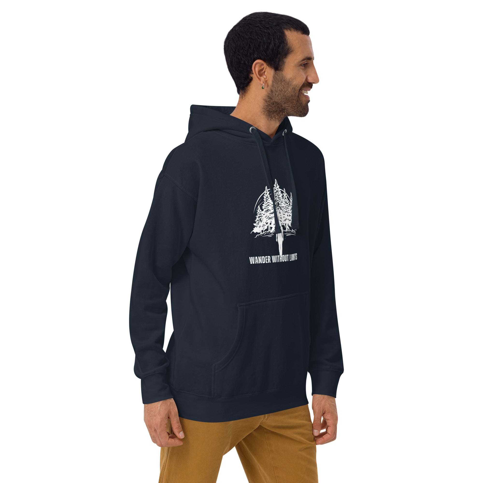 Man wearing black Wander Without Limits Hoodie with wilderness graphic and front pocket, styled for outdoor adventure and casual wear.