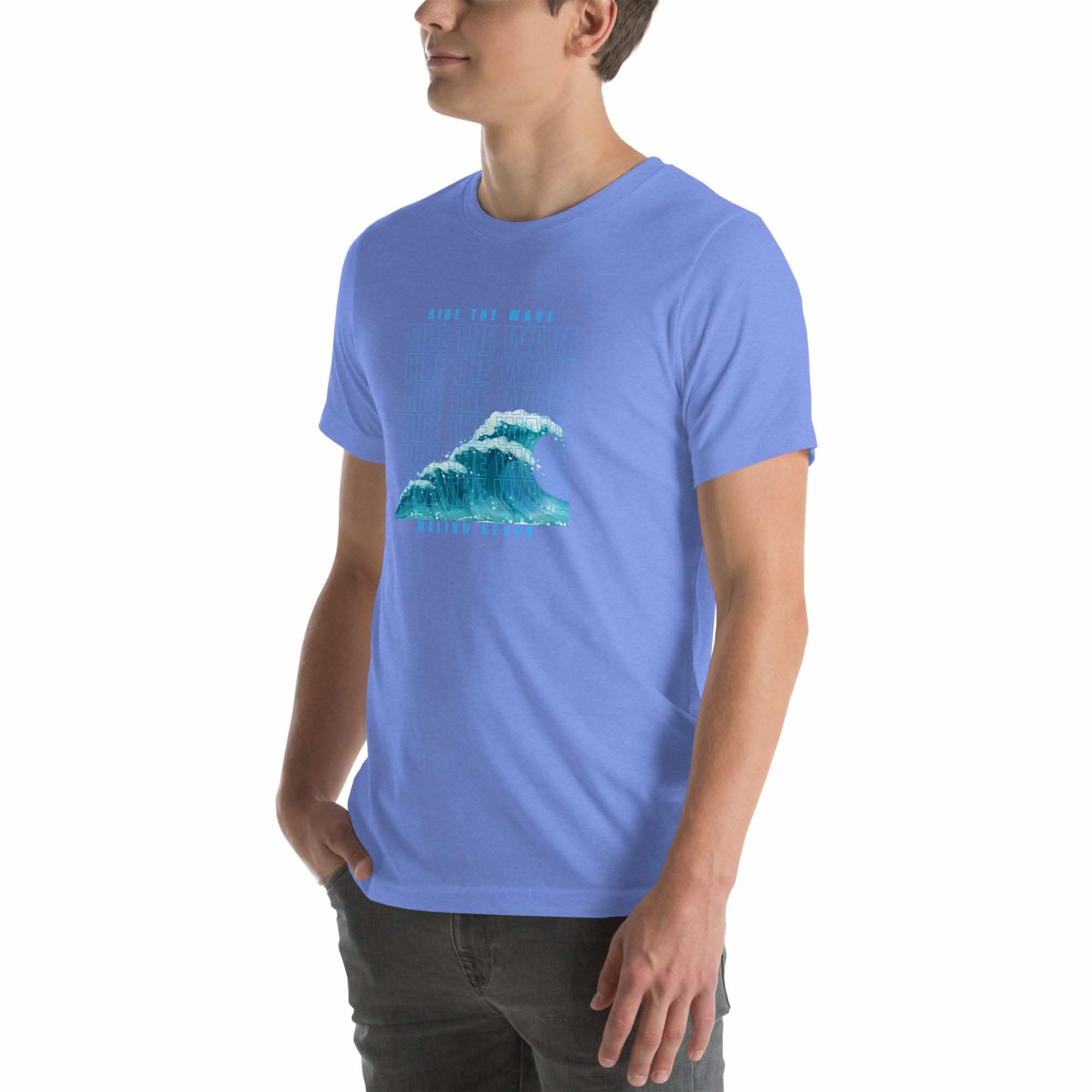 Man wearing light blue Ride the Wave T-Shirt with wave graphic on front