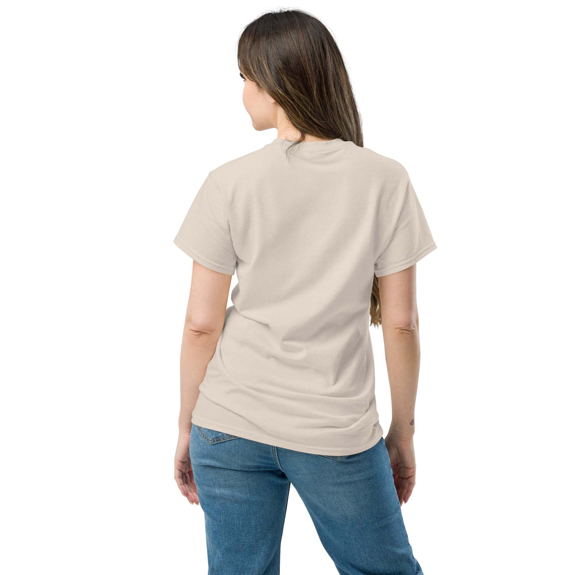 Woman wearing beige heart t-shirt showing back, paired with jeans, casual romantic style