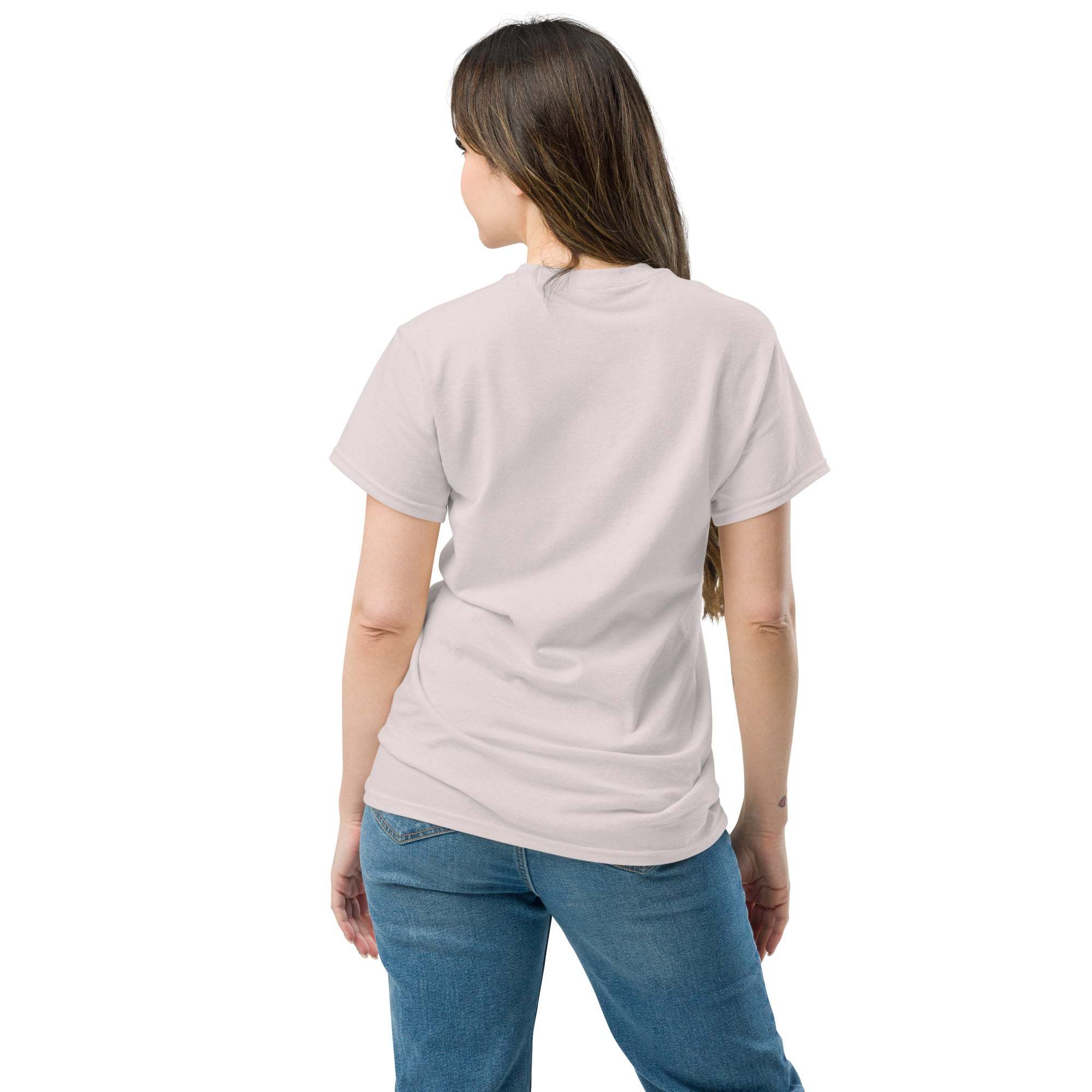 Woman wearing a light pink unisex heart t-shirt seen from the back with blue jeans