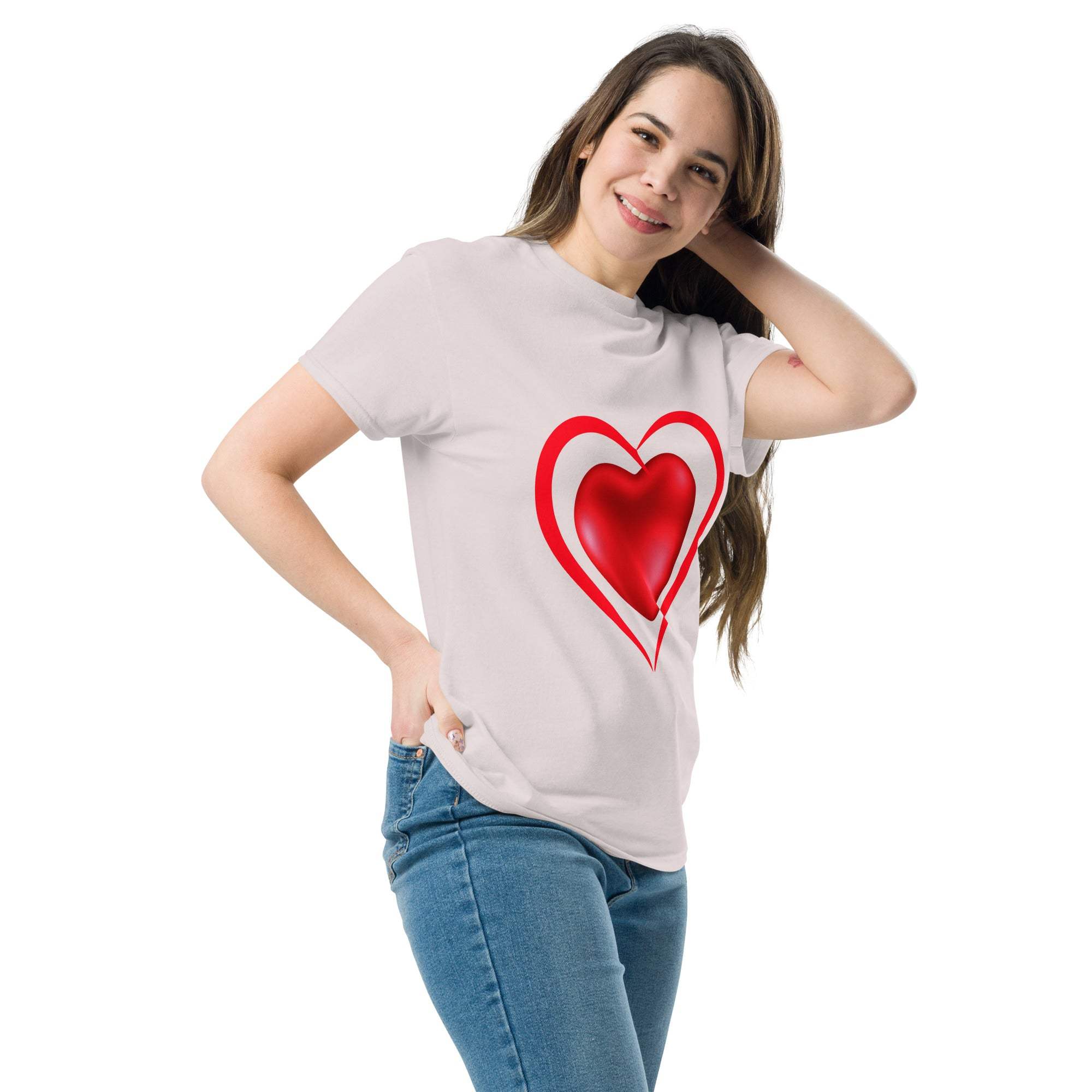 Woman wearing white romantic heart t-shirt with red heart graphic, paired with blue jeans