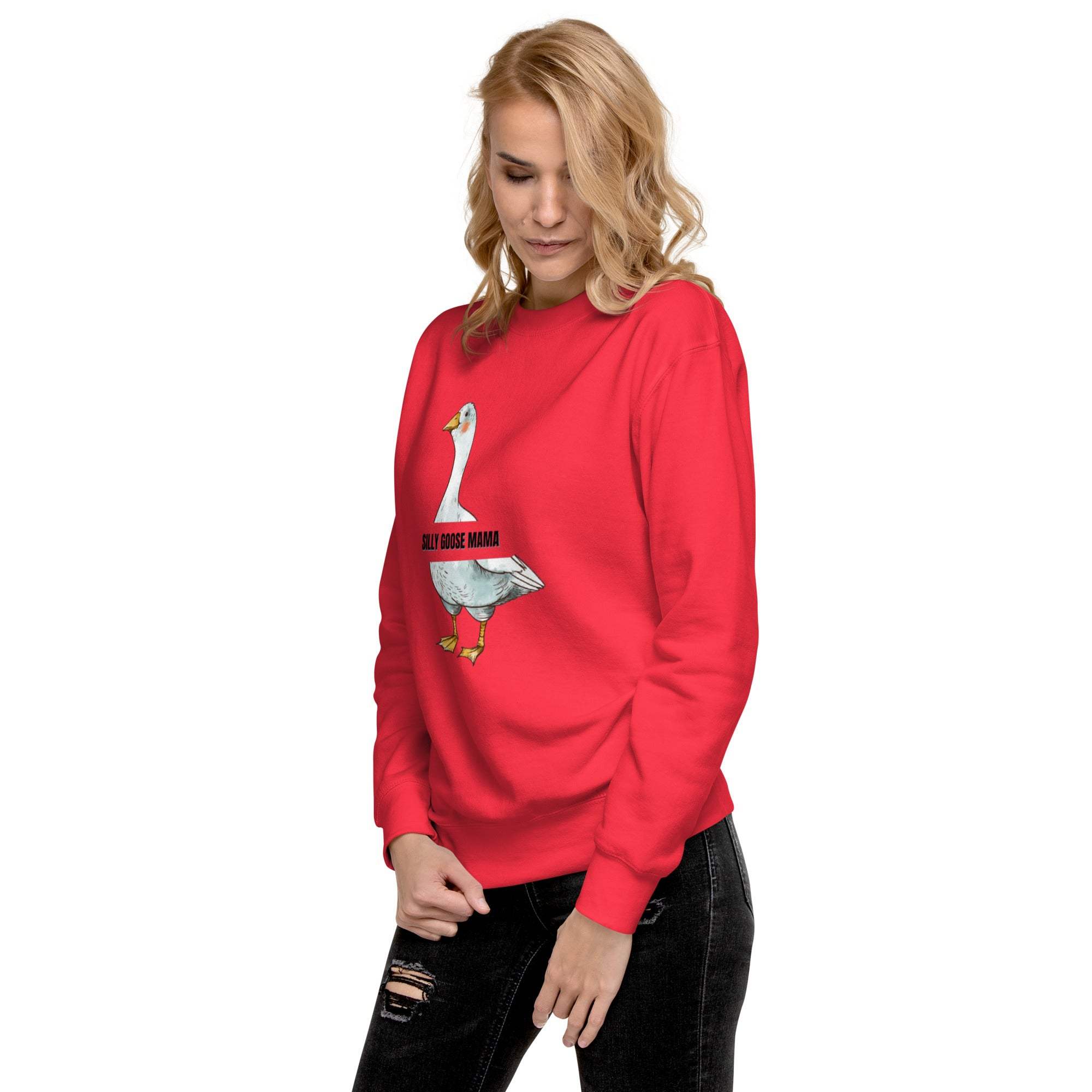 Woman wearing a red Silly Goose Mama Sweatshirt with a playful goose graphic and text on the front