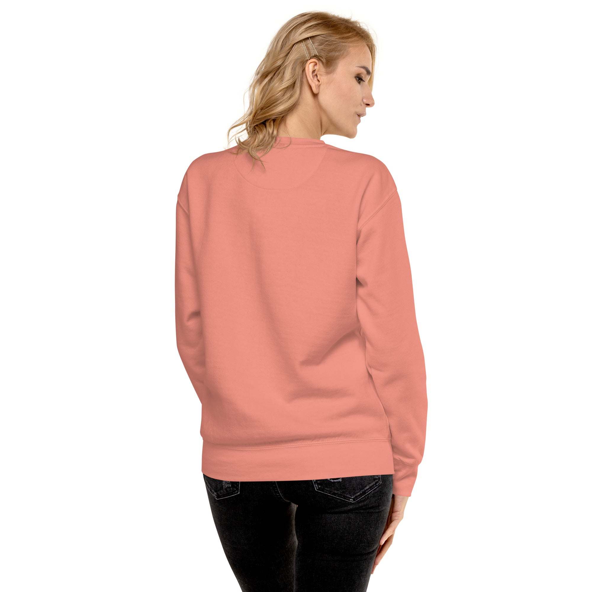 Woman wearing a pink Silly Goose Mama sweatshirt seen from the back