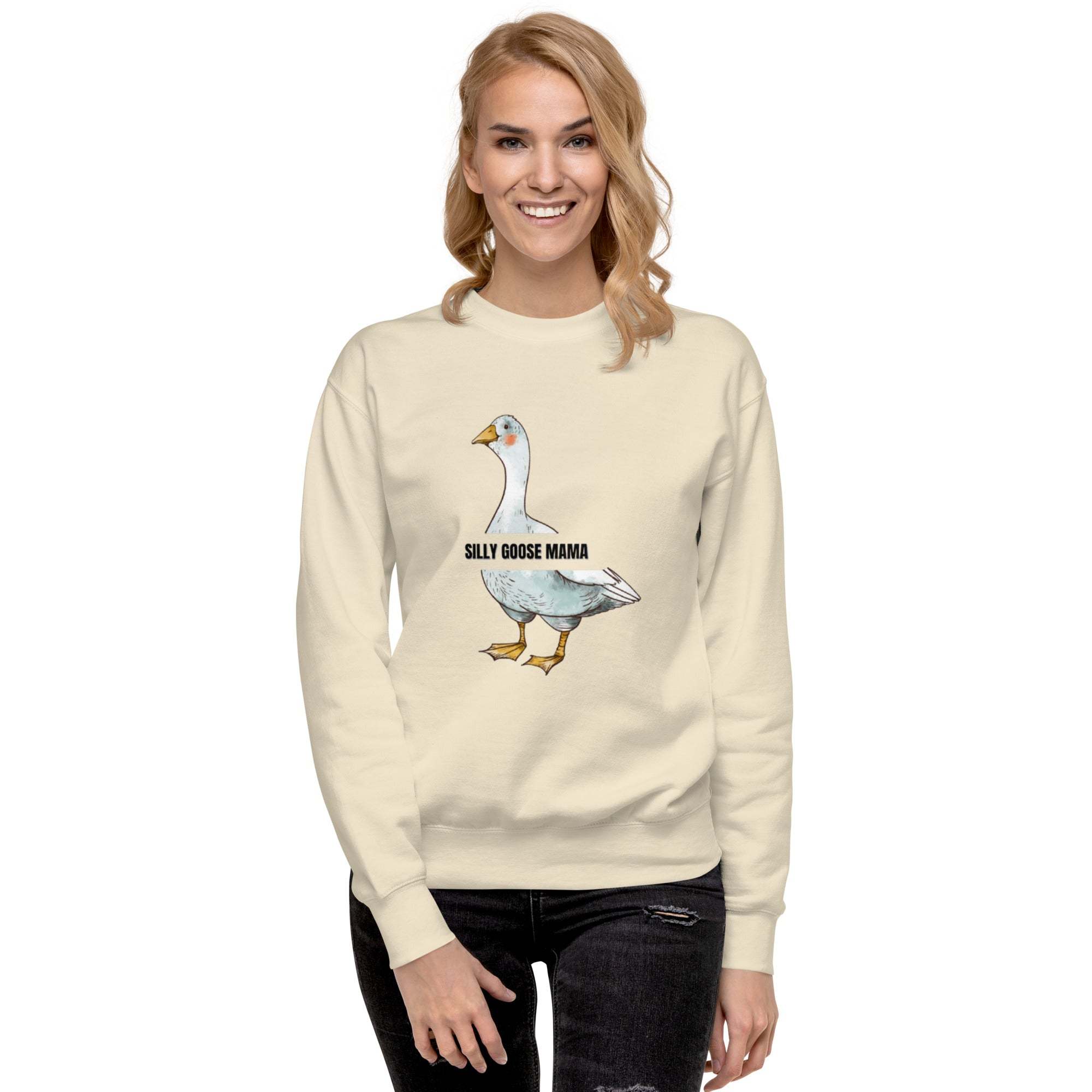 Woman wearing beige Silly Goose Mama Sweatshirt with goose illustration and text, casual cozy style