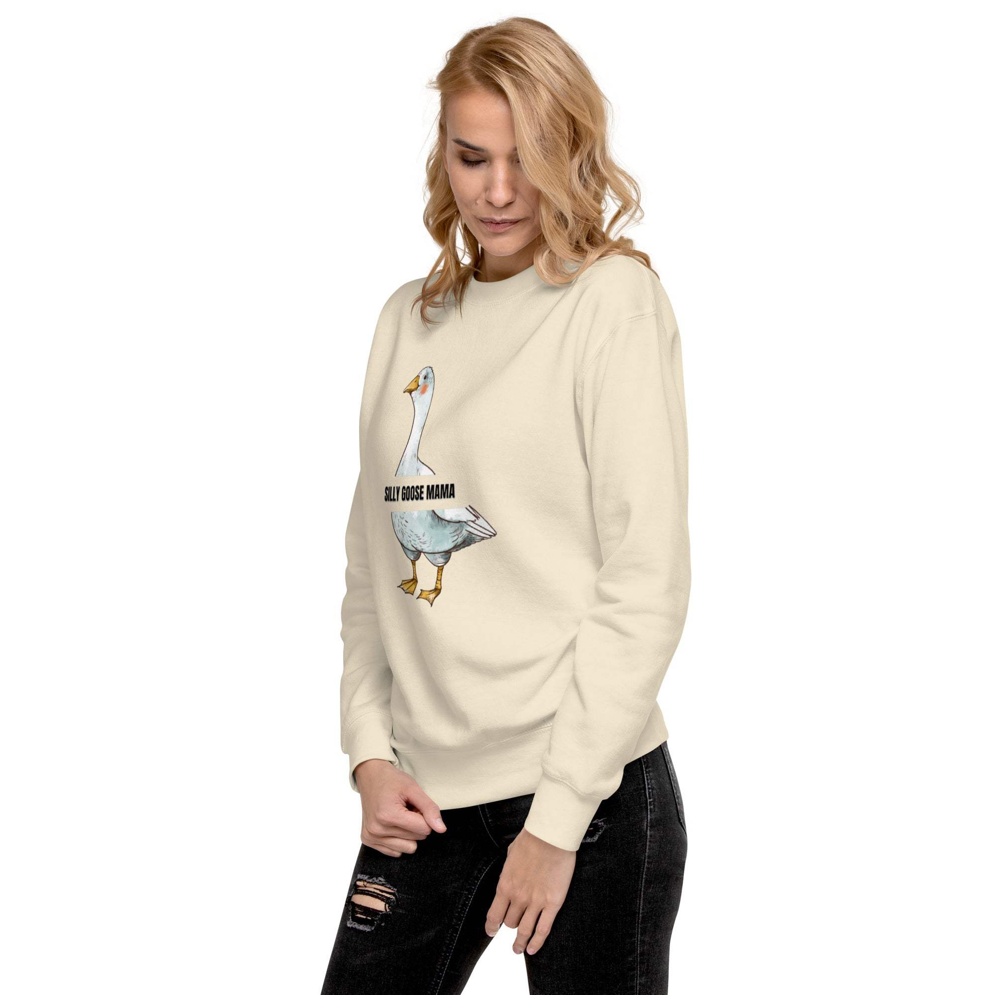 Woman wearing beige Silly Goose Mama Sweatshirt with goose graphic and text on front