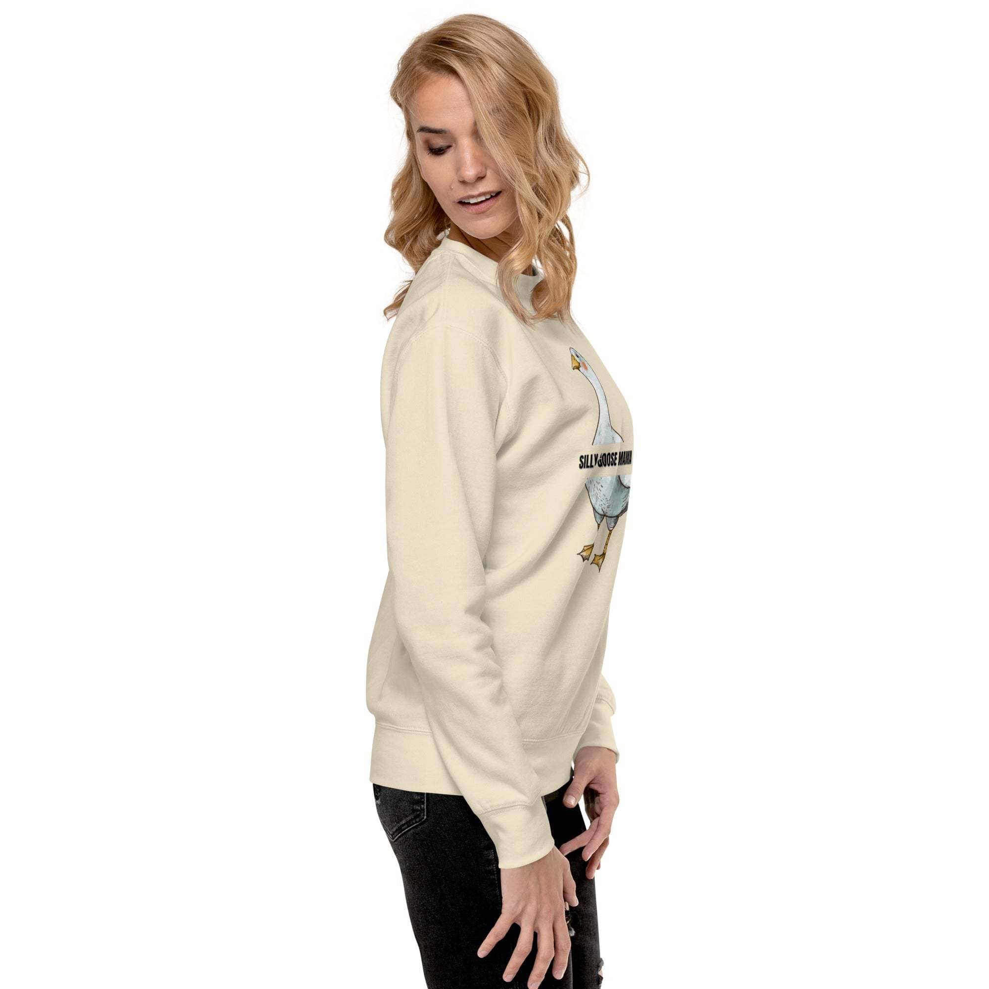 Woman wearing beige Silly Goose Mama sweatshirt with playful goose design and text