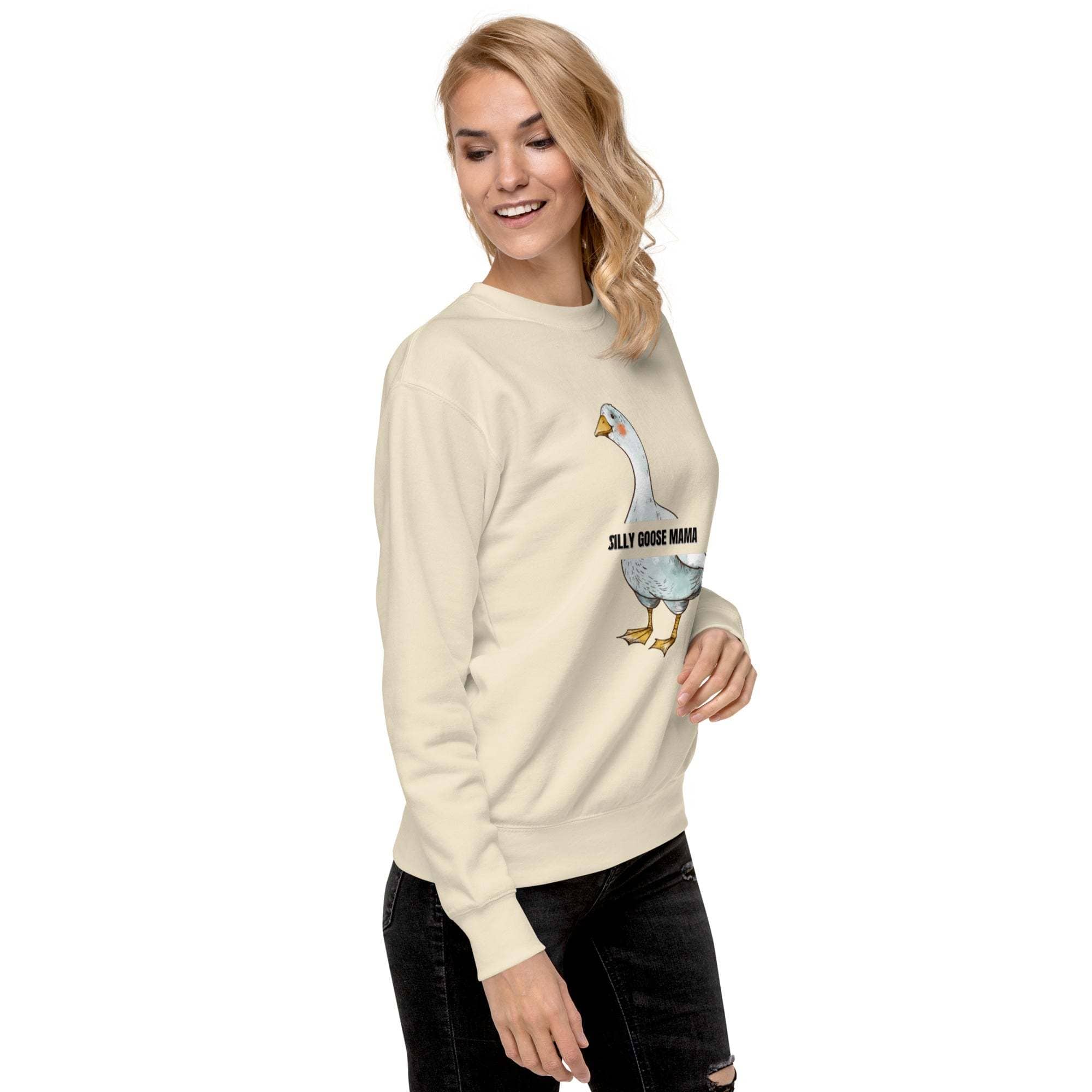 Woman wearing cream Silly Goose Mama Sweatshirt with goose illustration and text on front