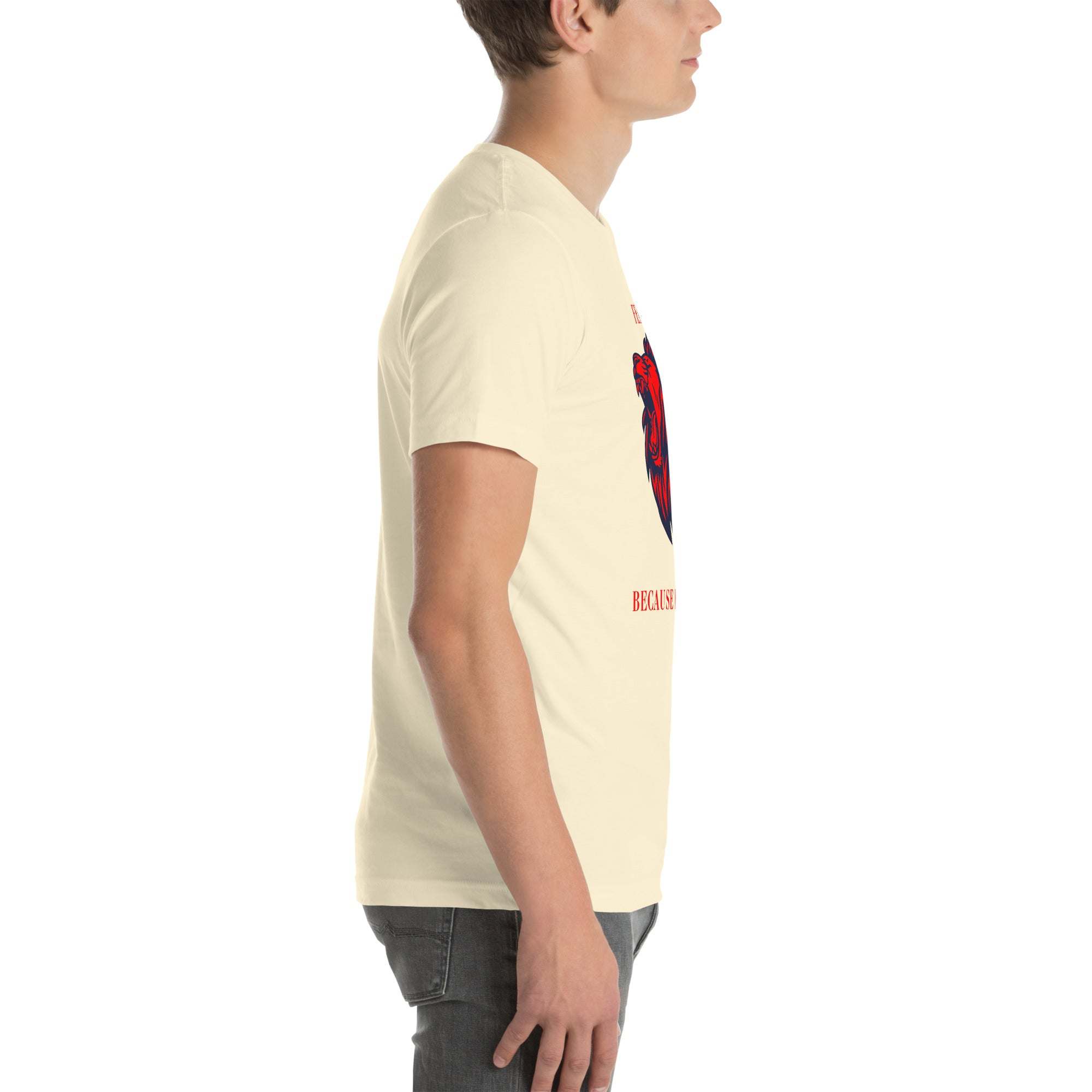 Side view of a man wearing a cream Fearless Lion T-Shirt with a red and black lion head design.