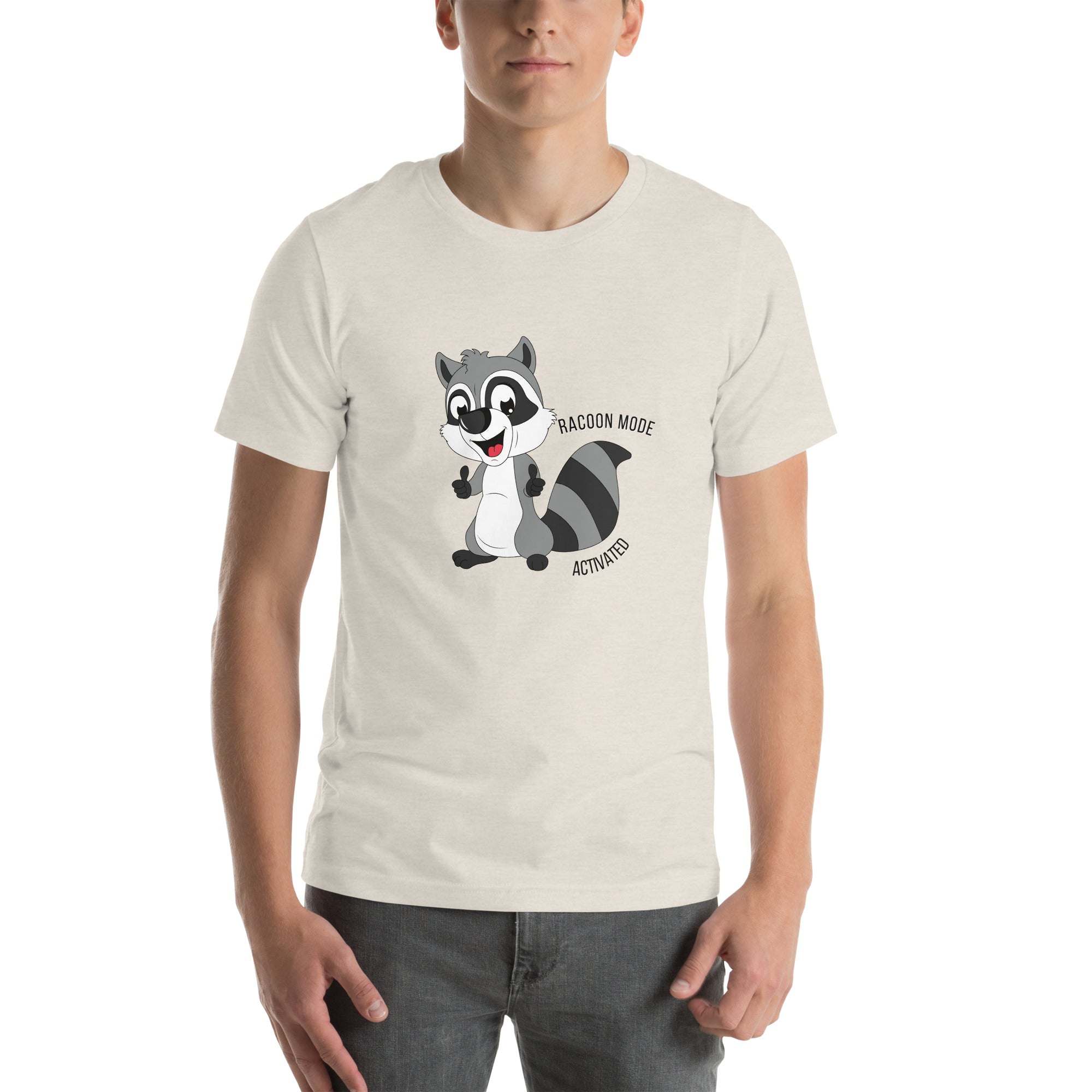 Man wearing a beige Raccoon Mode T-Shirt with cartoon raccoon and "Raccoon Mode Activated" text, soft cotton fabric.