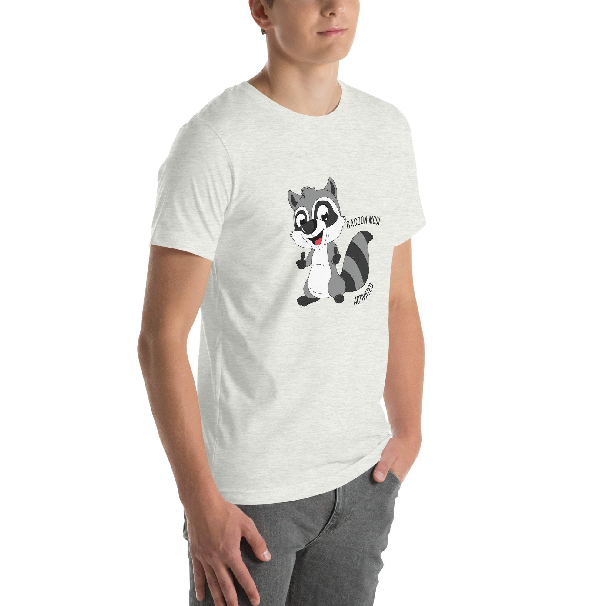 Man wearing a light gray Raccoon Mode T-Shirt with a cartoon raccoon and "Raccoon Mode Activated" text on the front
