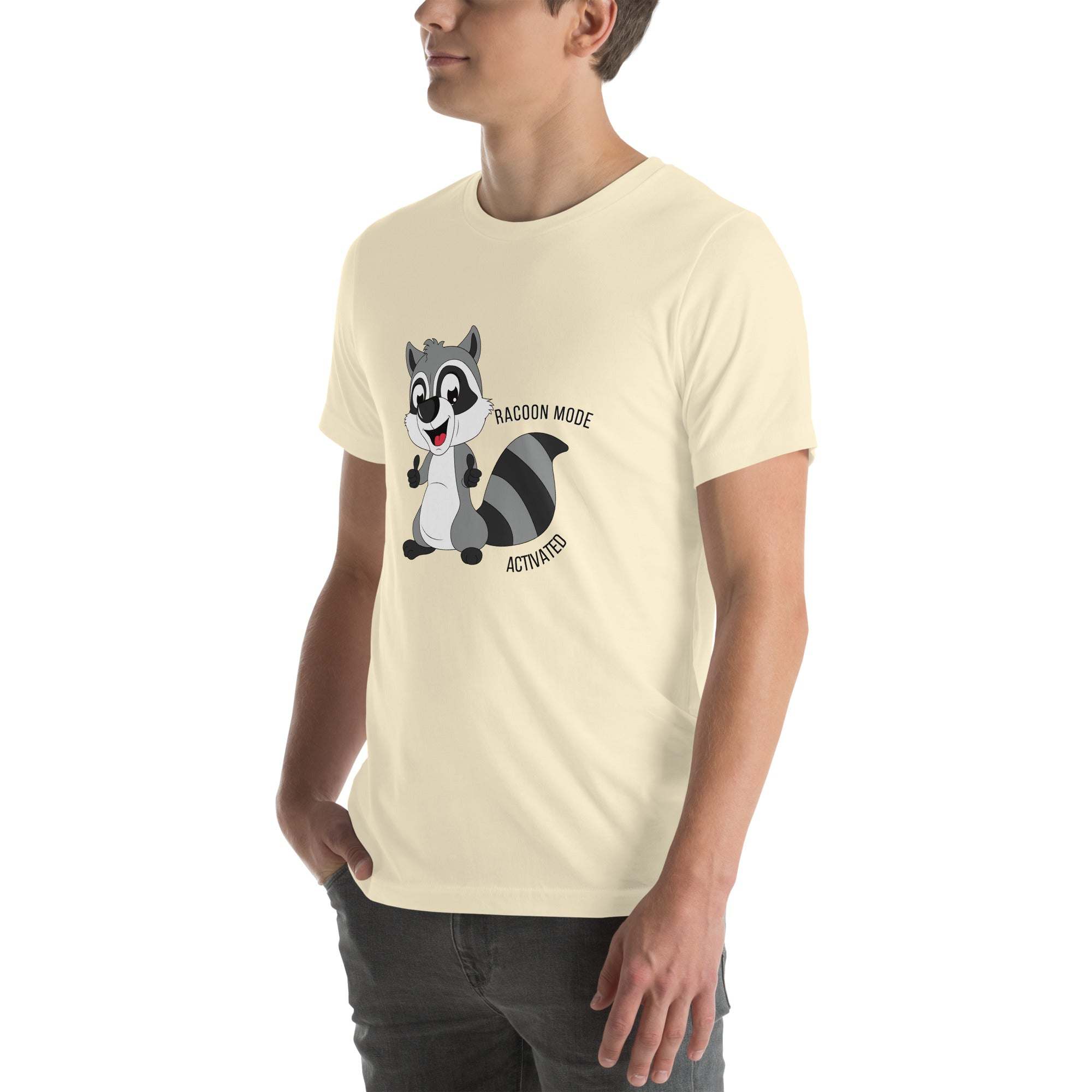 Man wearing beige Raccoon Mode T-Shirt with cartoon raccoon and text "Raccoon Mode Activated"