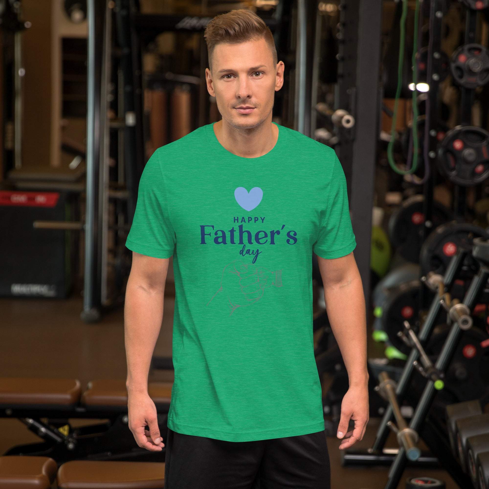 Man wearing green Happy Father's Day T-Shirt with heart and hand design in gym setting