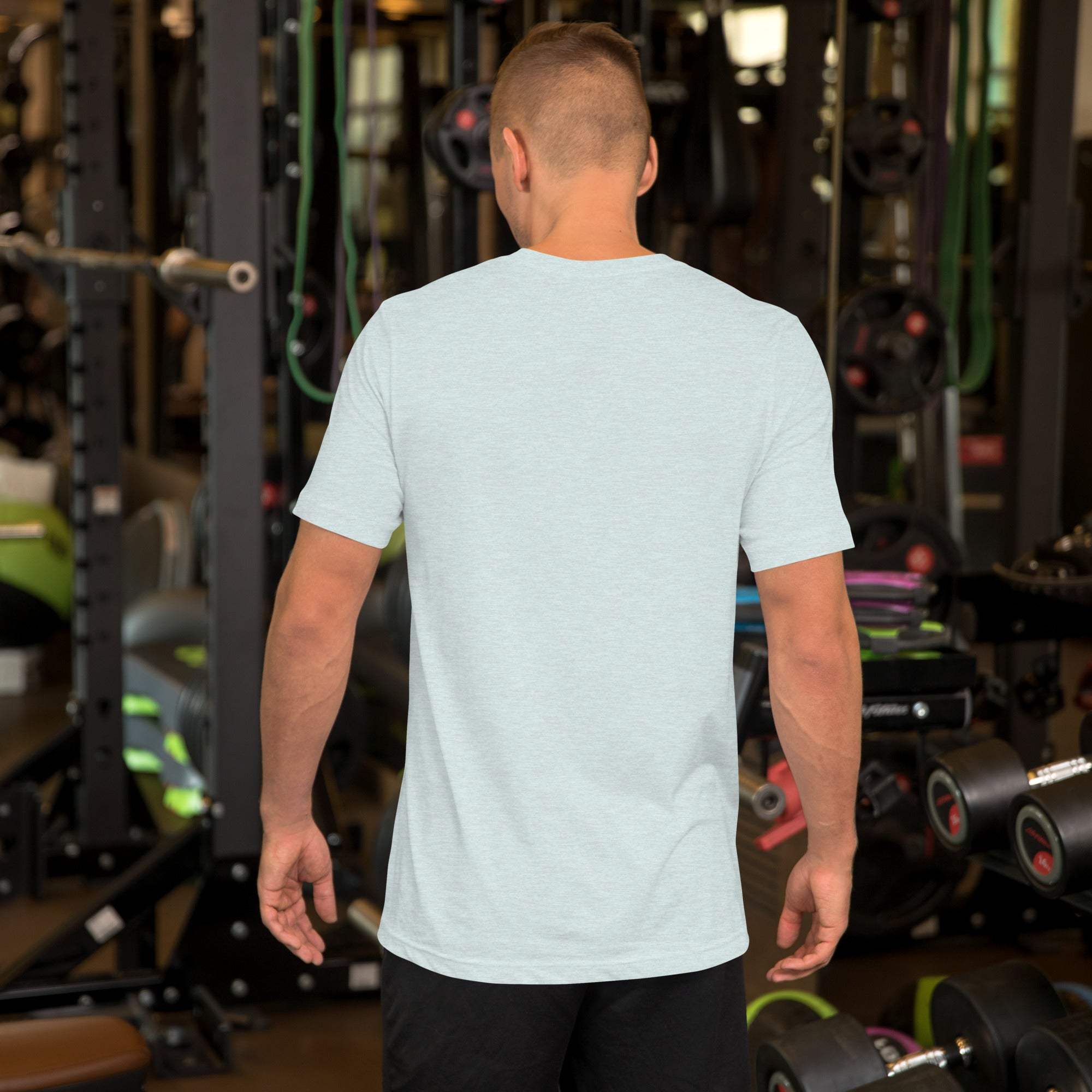 Back view of man wearing light grey Happy Father's Day T-Shirt with heart and hand design in gym setting