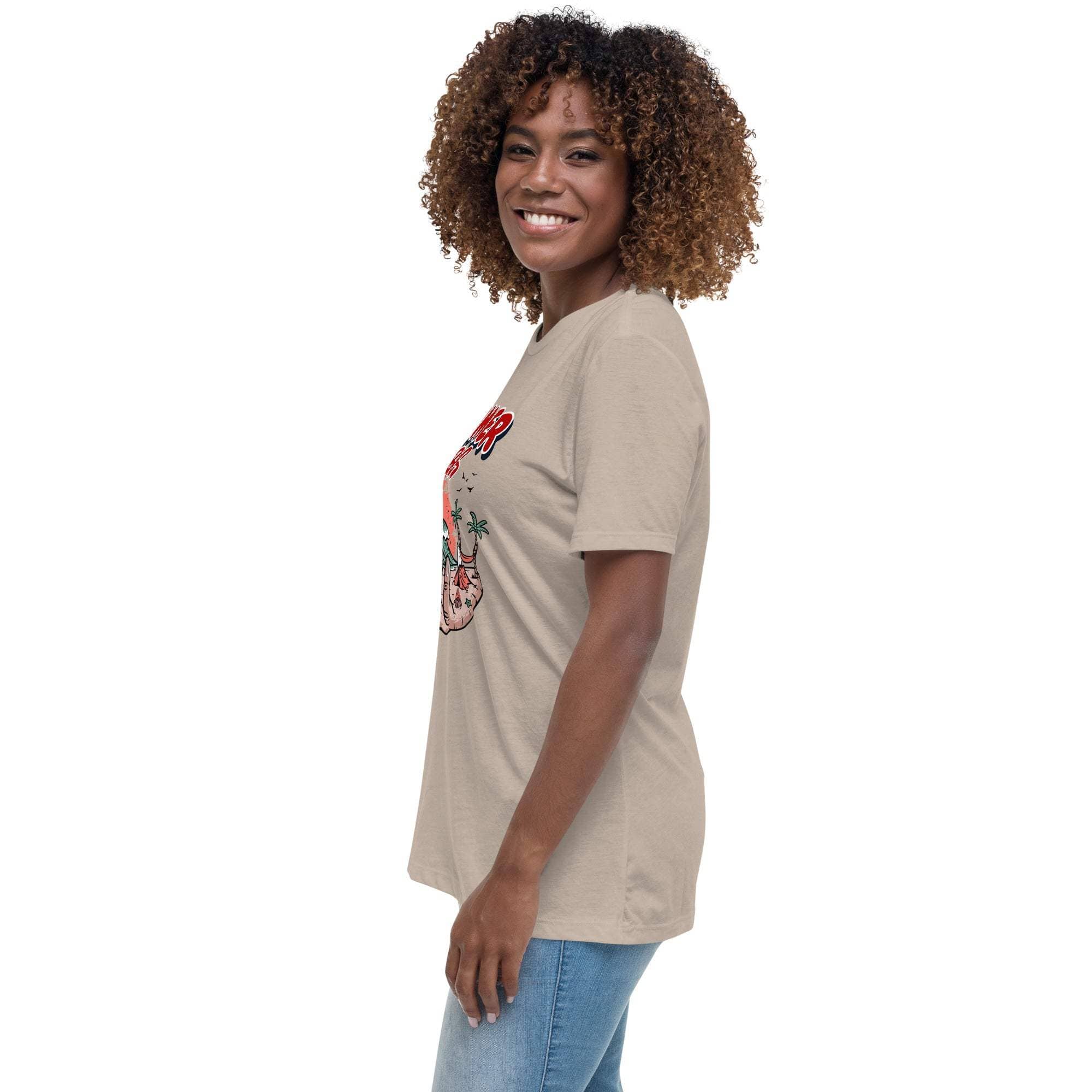 Woman wearing a beige Summer Vibes T-Shirt with retro beach graphic, paired with blue jeans, side view