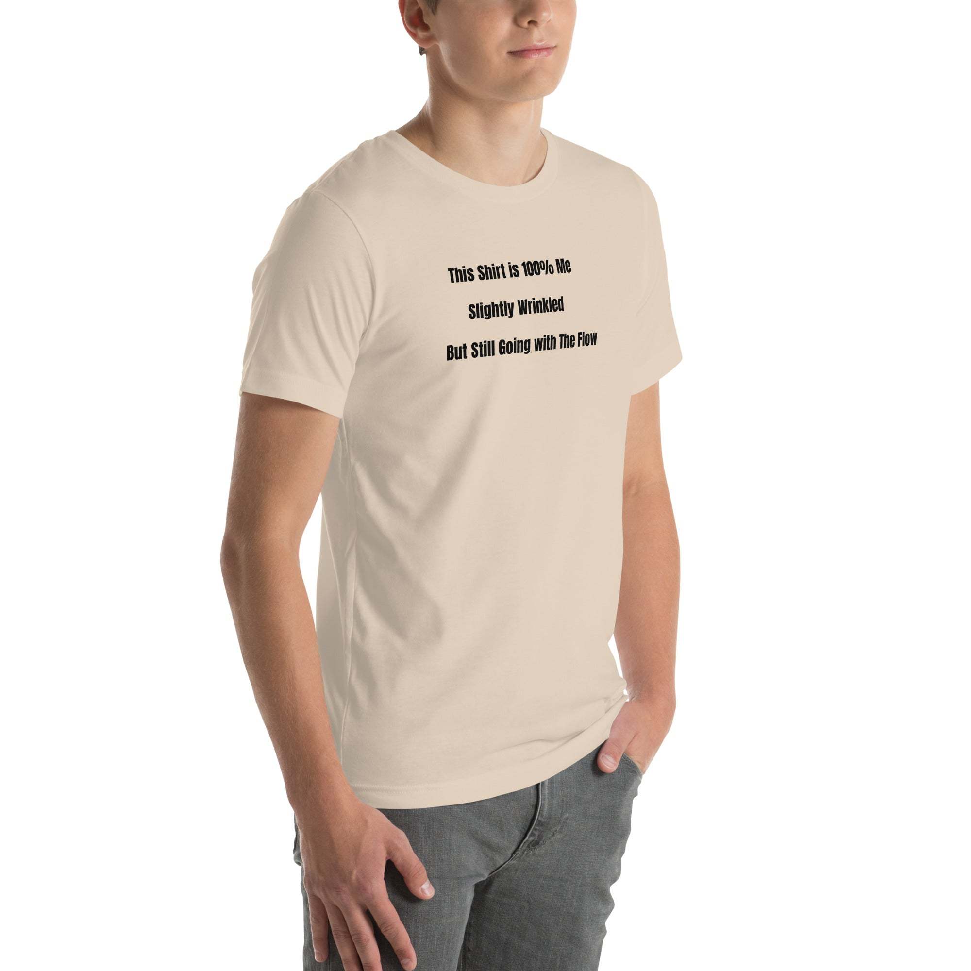 Man wearing beige funny wrinkled Old Person Humor T-shirt with black text "This Shirt is 100% Me Slightly Wrinkled But Still Going with the Flow"