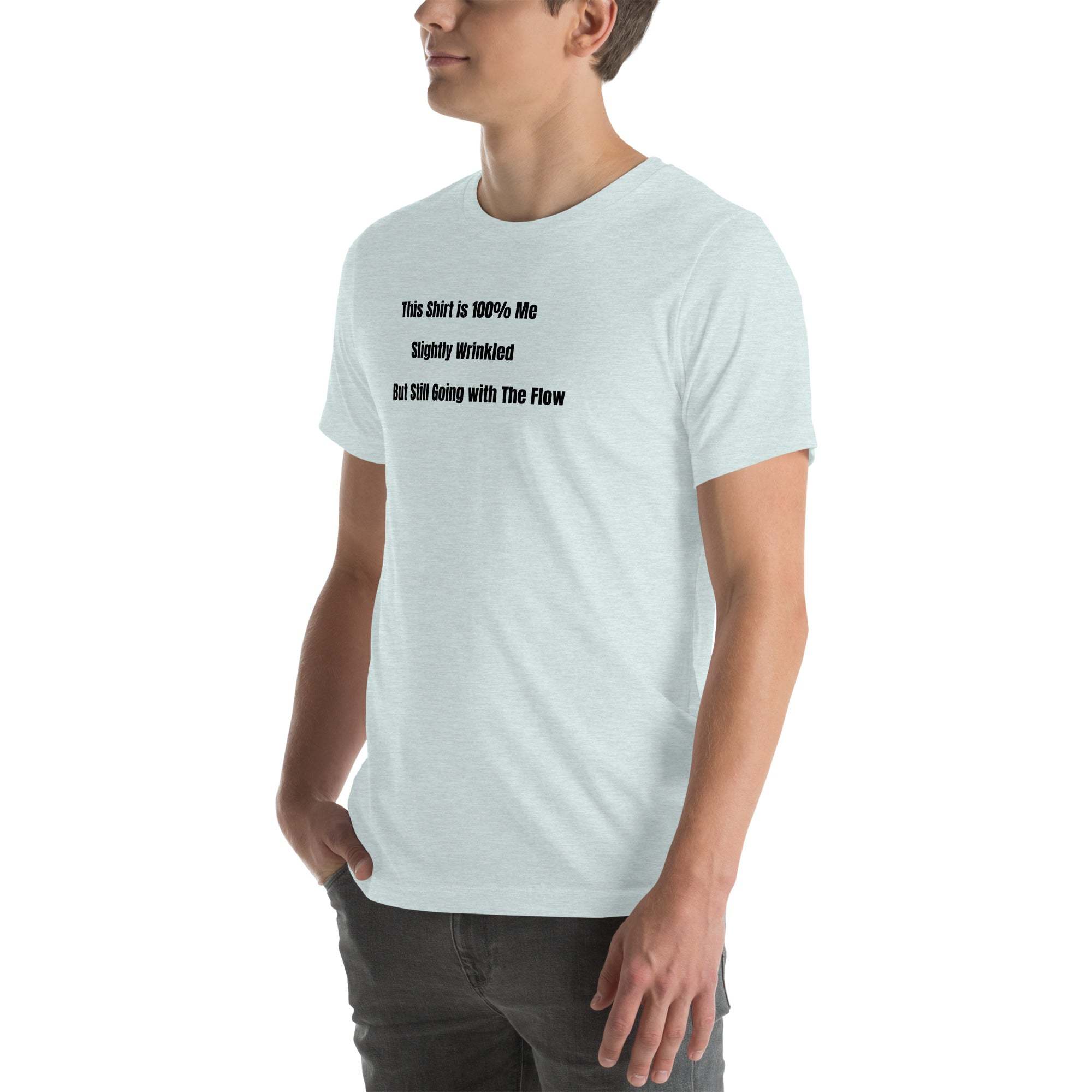 Man wearing light gray funny wrinkled t-shirt with humorous "This Shirt is 100% Me – Slightly Wrinkled but Still Going with the Flow" text, casual old person humor tee.