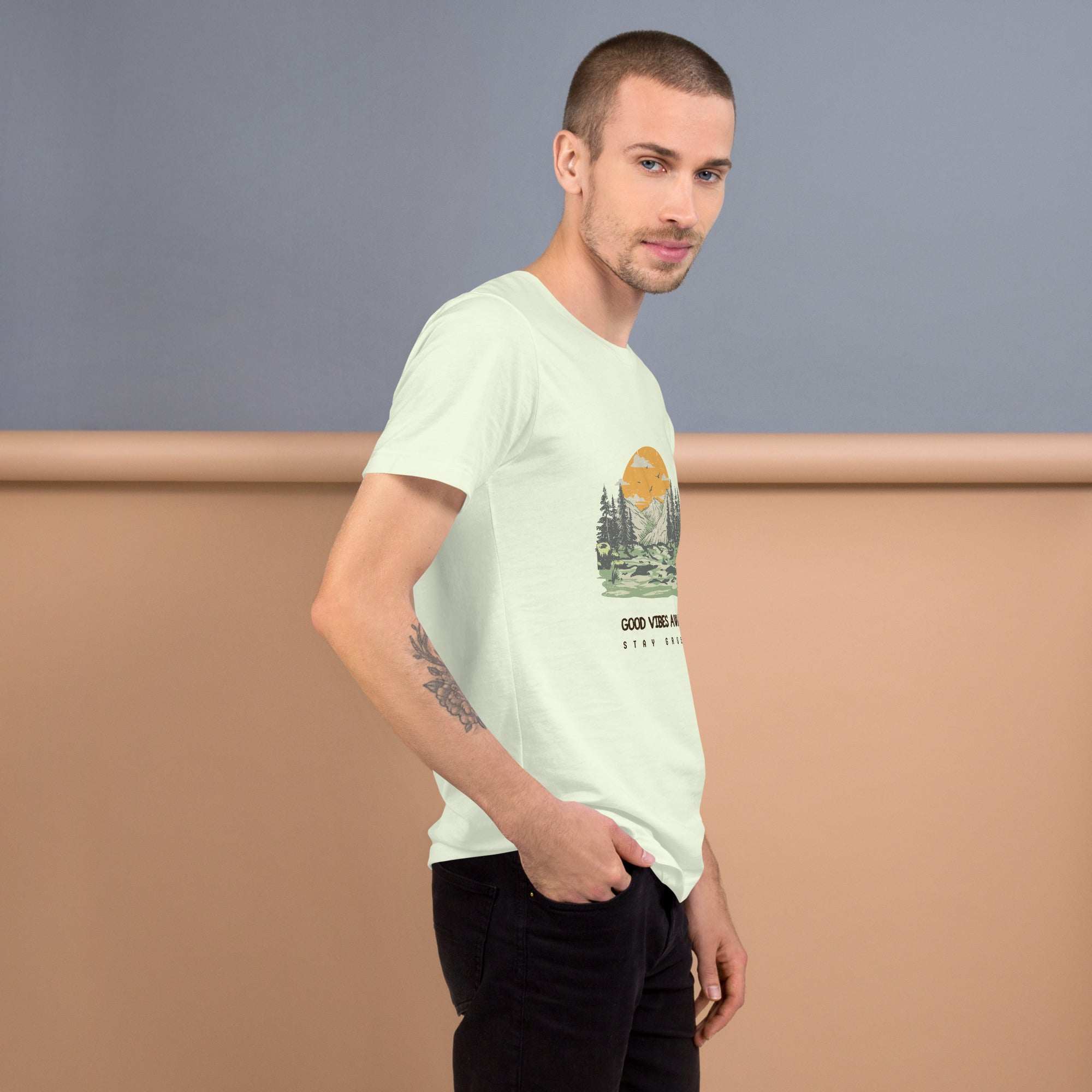 Man wearing soft lightweight Good Vibes T-Shirt with nature graphic, styled casually