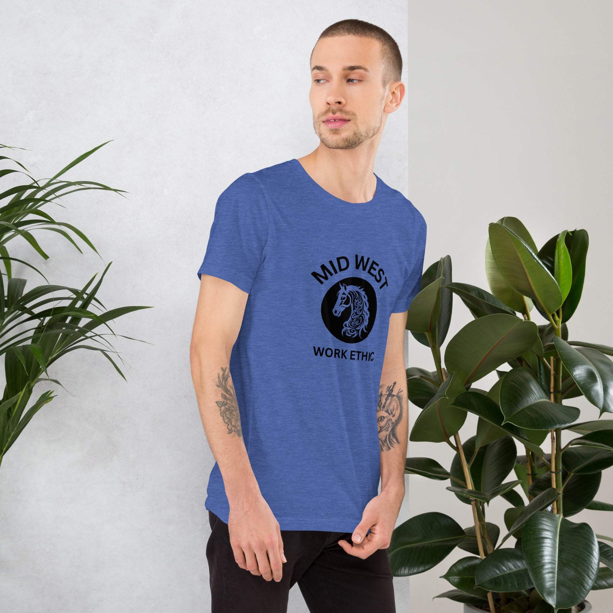 Man wearing blue Midwest T-Shirt with horse graphic and work ethic text
