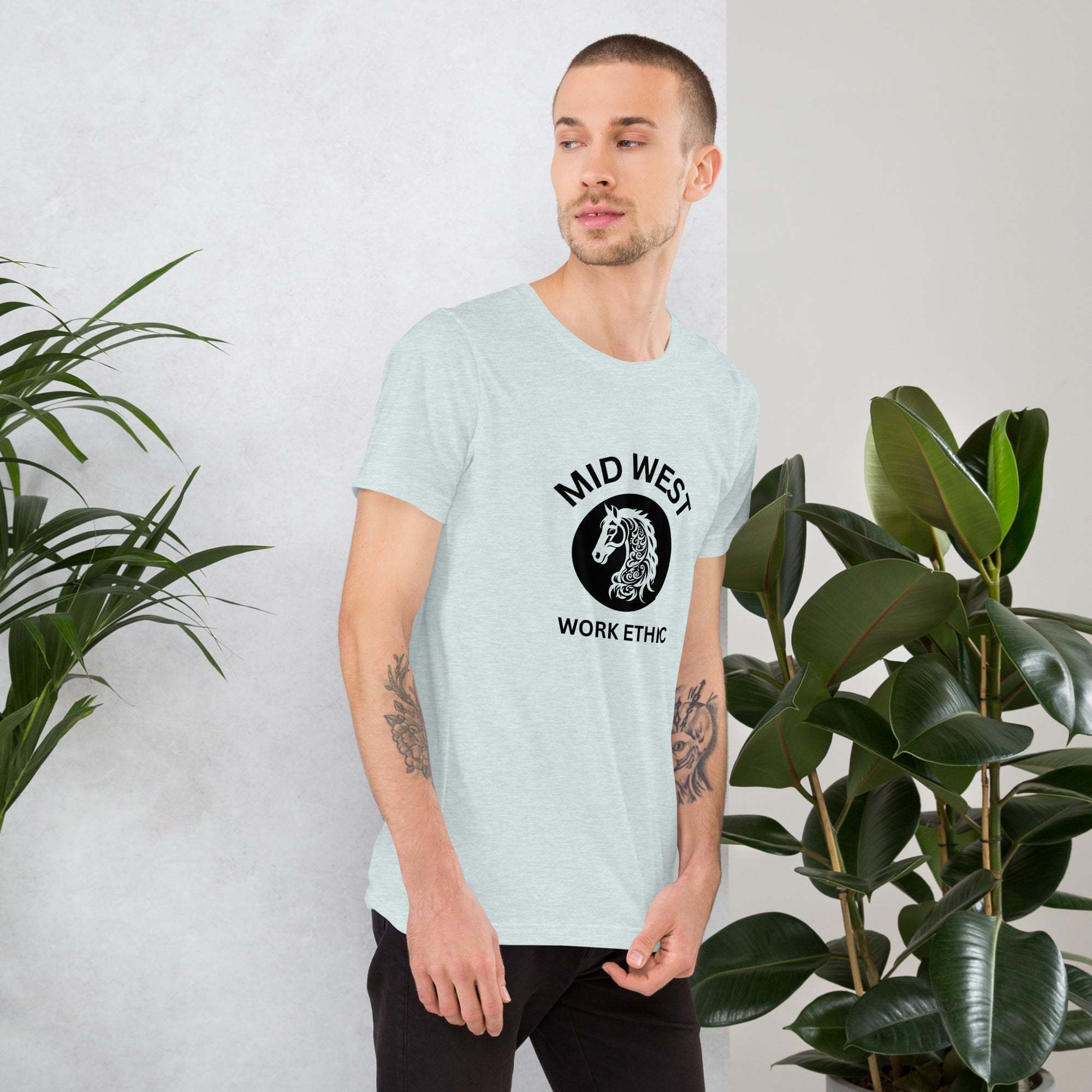 Man wearing light gray Midwest T-Shirt with black horse graphic and work ethic text