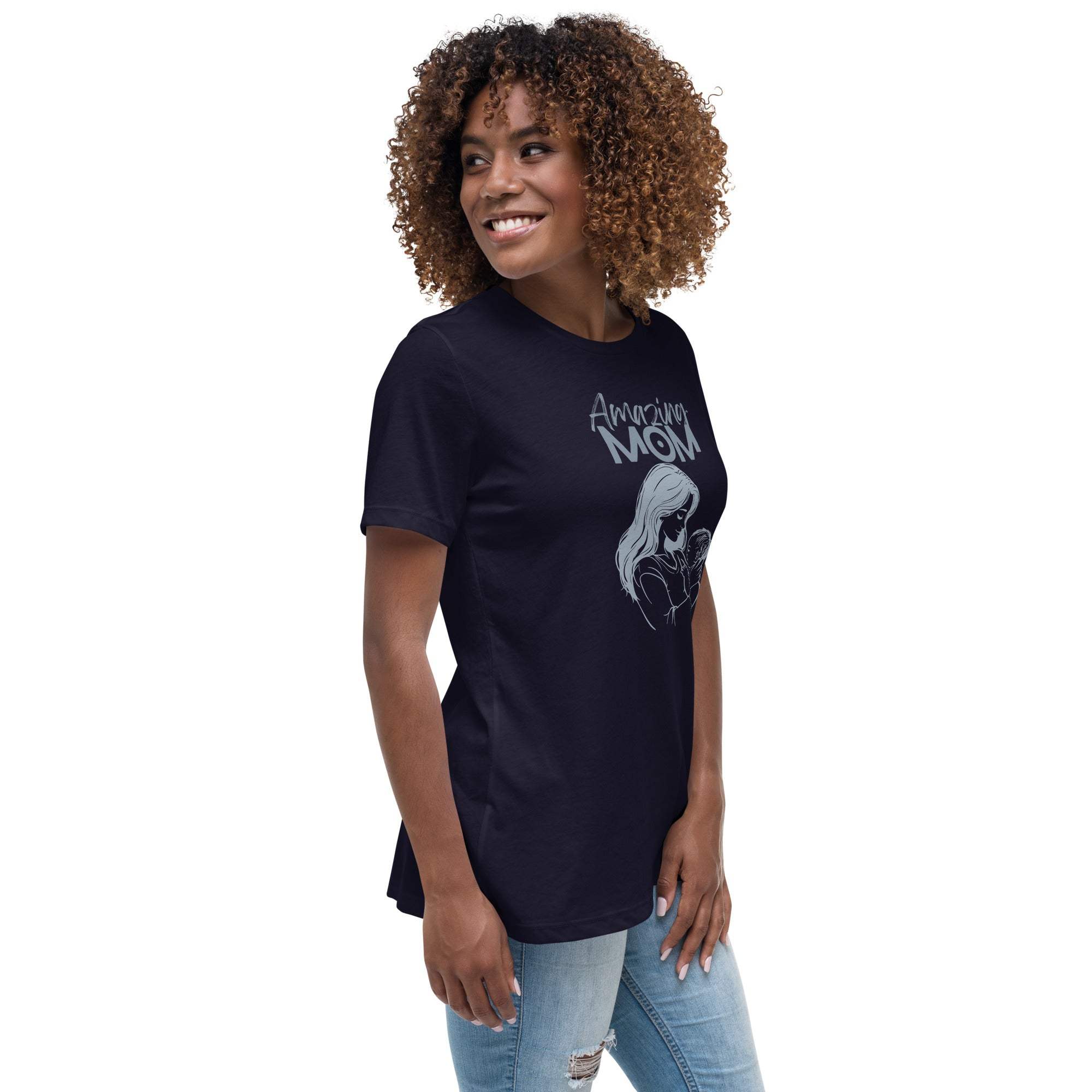 Woman wearing a black Amazing Mom T-Shirt with a graphic design, paired with light blue jeans.