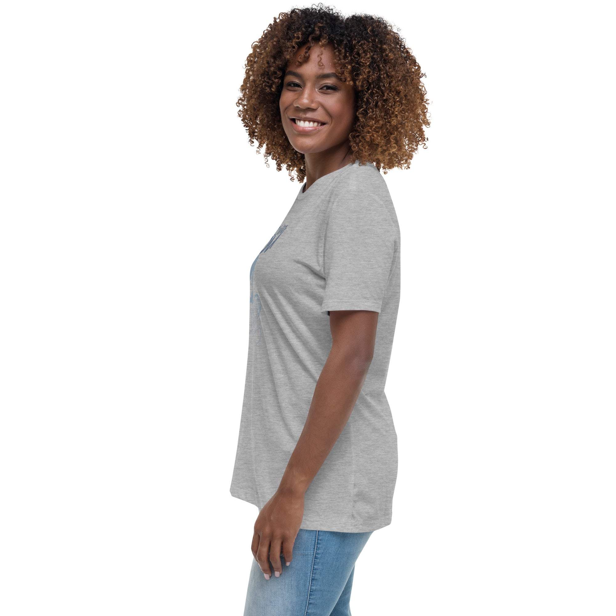 Smiling woman wearing a gray Amazing Mom T-Shirt with short sleeves and casual fit paired with blue jeans.